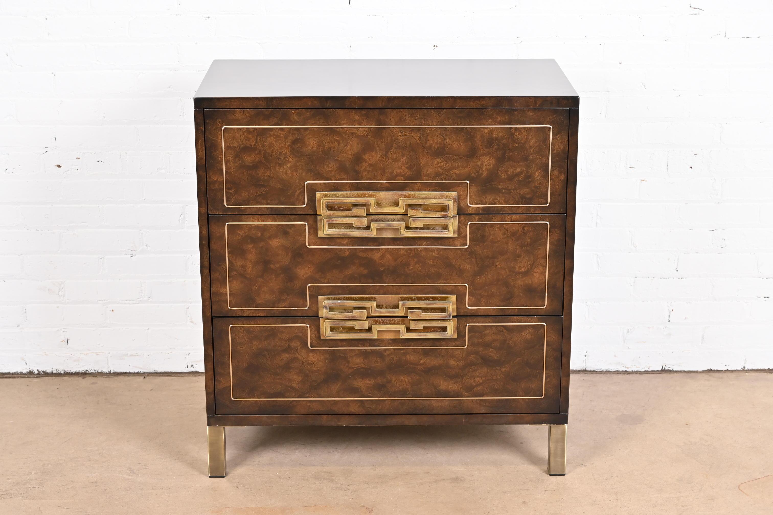 A gorgeous Mid-Century Modern Hollywood Regency dresser or chest of drawers

By William Doezema for Mastercraft

USA, 1970s

Burled Carpathian elm wood, with inlaid brass details and Greek Key brass hardware.

Measures: 32