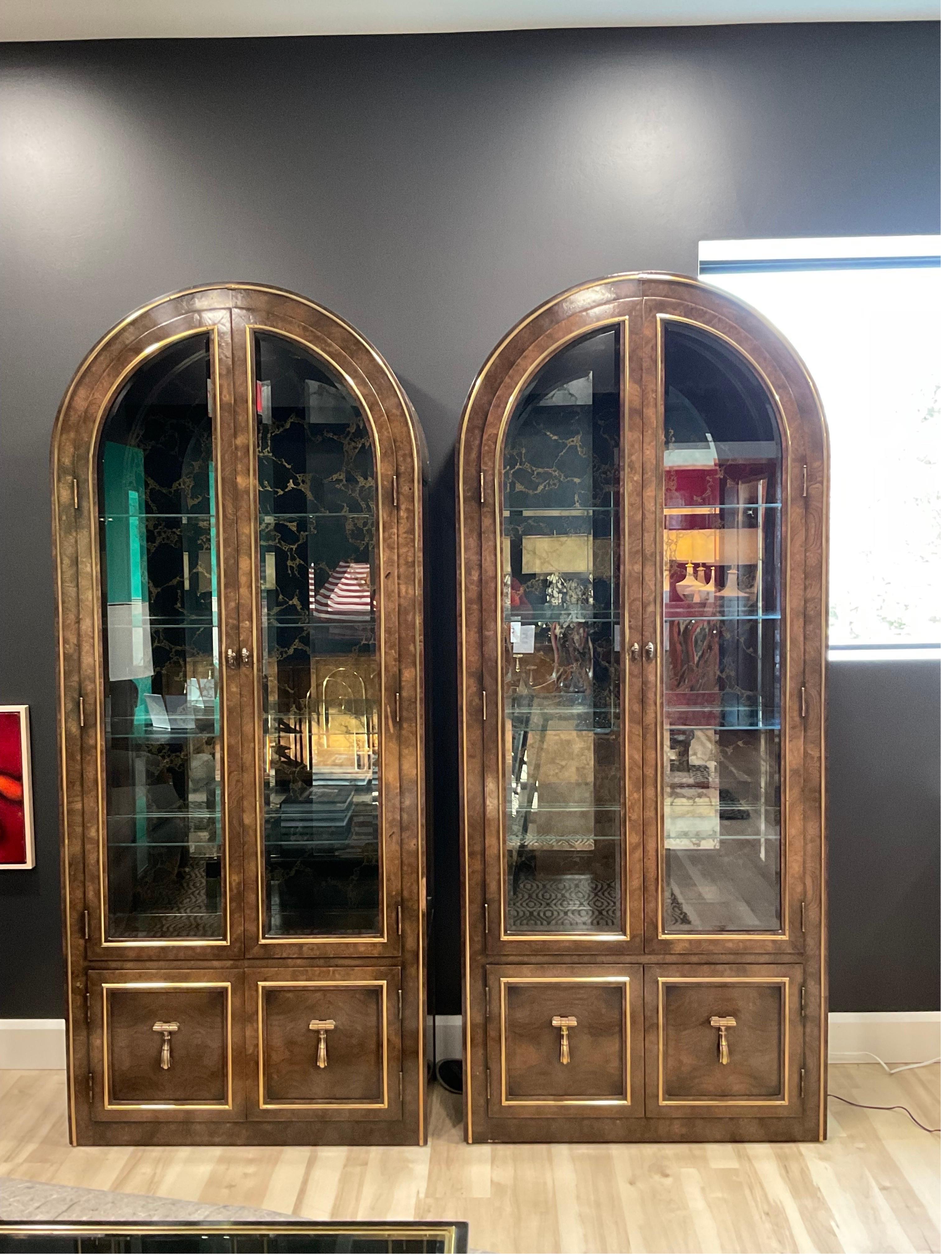 Spectacular pair of Burled Wood, lighted display cases with Eglomise mirrored backs by William Doezema for Mastercraft. Circa 1950’s. Very subtle signs of wear/use Brilliant pieces. The amazing detail that Mastercraft put into these pieces would be