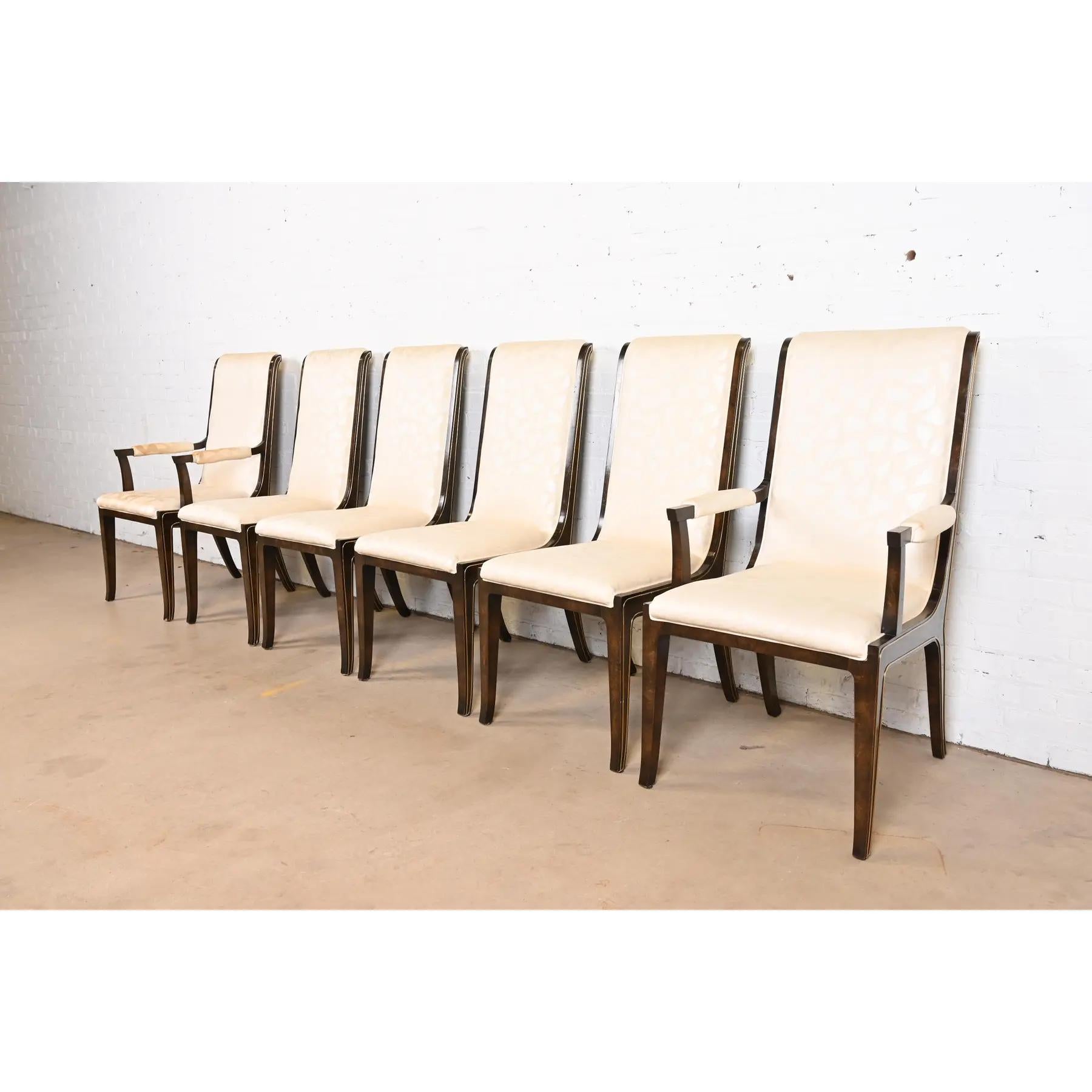 A gorgeous set of six mid-century modern Hollywood Regency dining chairs

By William Doezema for Mastercraft

USA, 1970s

Beautiful burled Carpathian elm wood frames, with brass details, and upholstered seats and backs.

Measures:
Side chairs -