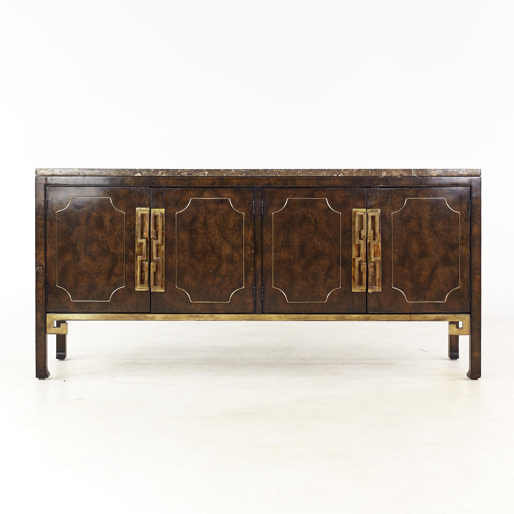 William Doezema for Mastercraft Mid Century Burlwood and Brass Inlay Buffet Credenza

This credenza measures: 64 wide x 18 deep x 30 inches high

All pieces of furniture can be had in what we call restored vintage condition. That means the piece is
