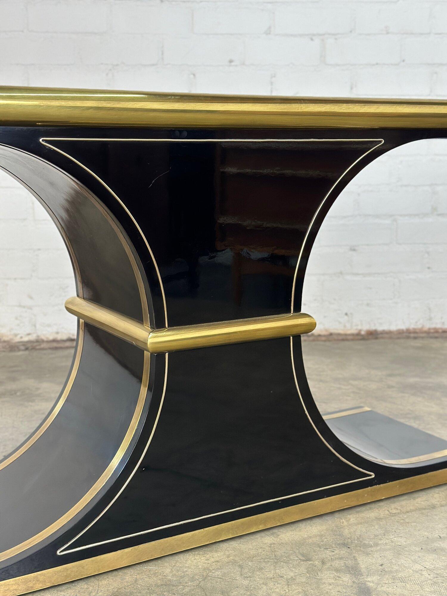 W60 D17 H30

Mastercraft Console table in brass and black lacquer. Console table is strucutrally sound and overall shows well with visble cracks or chips. Surface does show normal surfac scratches. 

