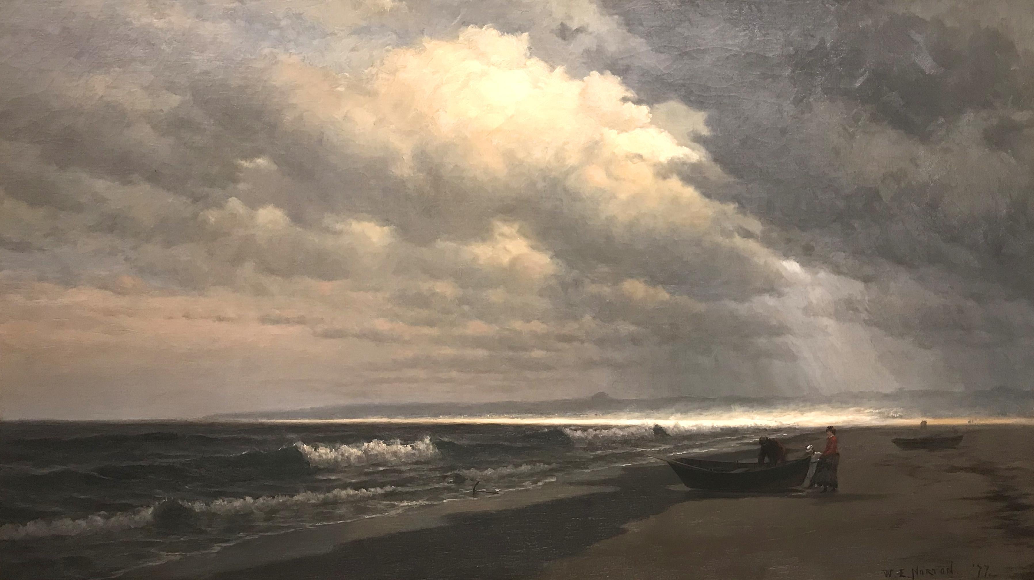 A large powerful marine coastal painting with clouds looming over figures and a dory on the beach painted by American artist William Edward Norton (1843-1916). Born in Boston, MA, Norton took to sailing at a young age, studying at the Lowell