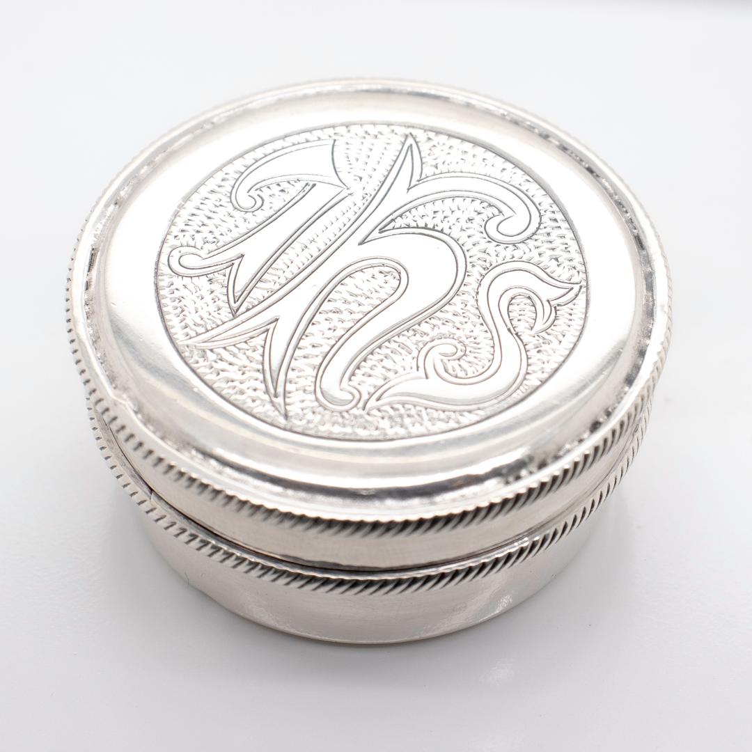 A fine Irish sterling silver pyx.

By William Egan. Dating to 1951.

In sterling silver with a gold wash to the interior.

A pyx is a travel box for carrying consecrated sacrament outside of the Church (for example to administer last rites to the
