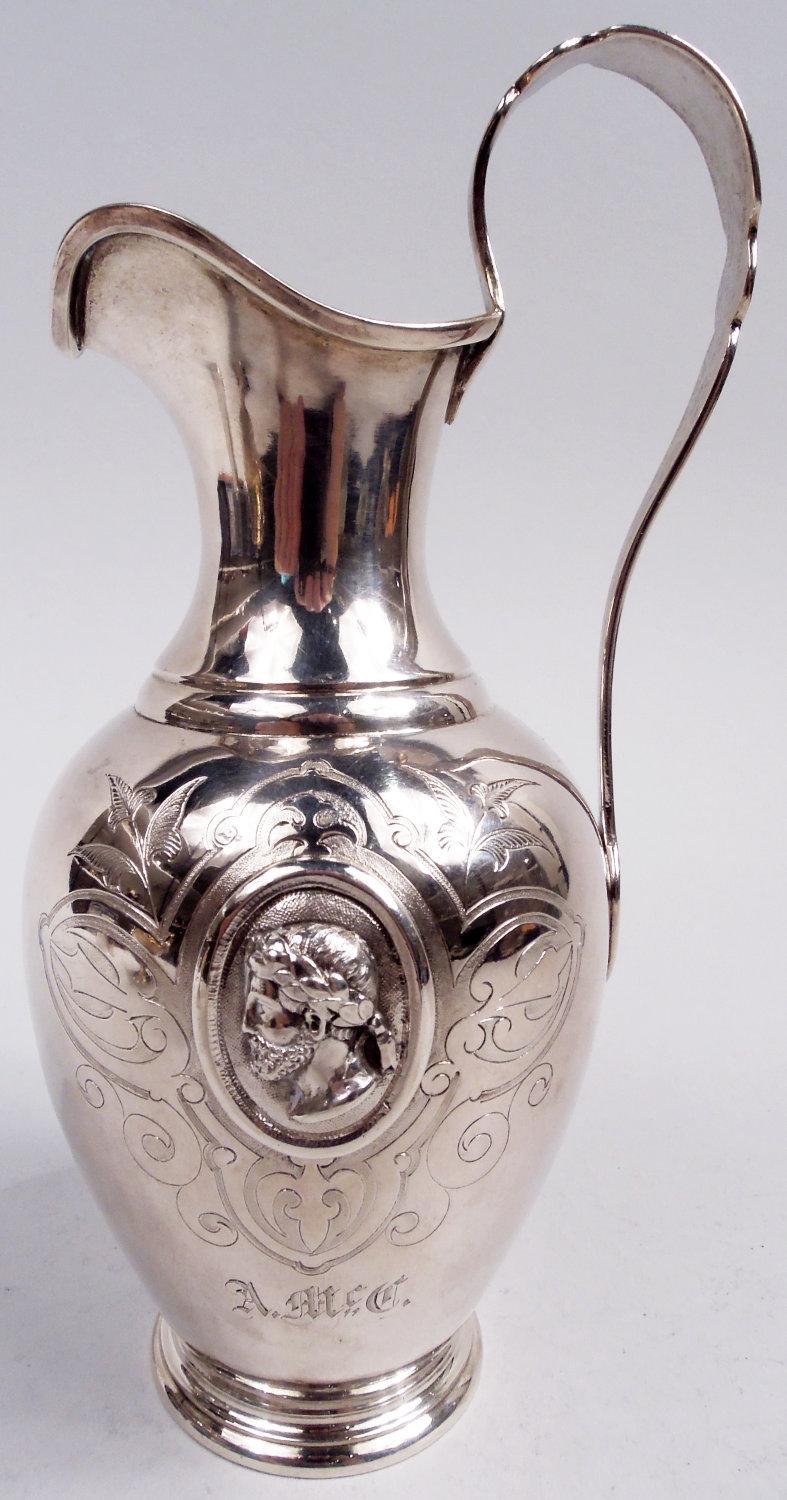 Medallion sterling silver creamer and sugar. Made by William Gale & Son in New York in 1862. Creamer ewer form with ovoid bowl, helmet mouth, high-looping handle, and stepped foot; gilt-washed interior. Sugar basket ovoid with asymmetrical scrolled
