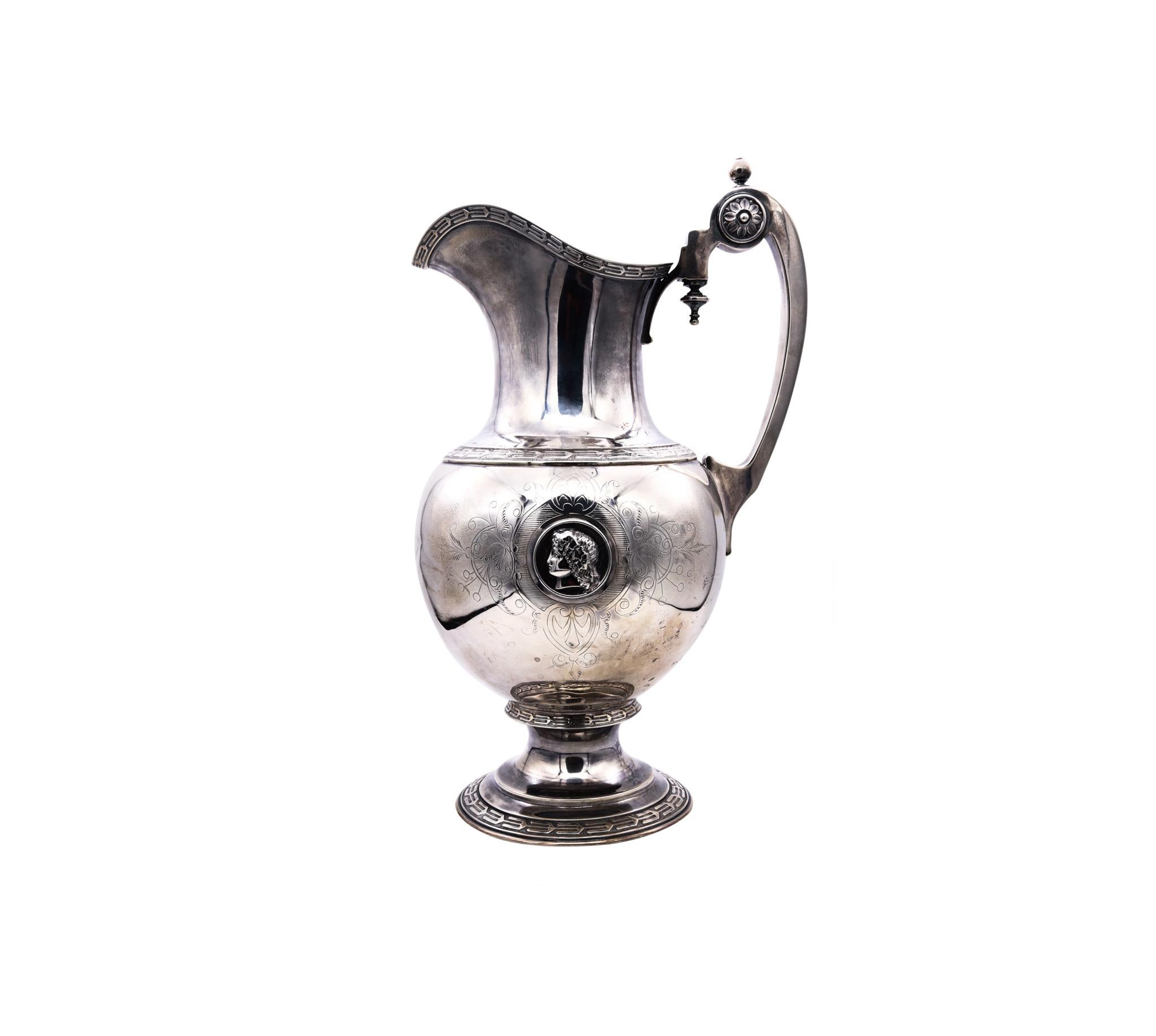 Medallion wine ewer designed by William Gale & Son.

Very rare and important piece of the American silversmith history. This fabulous wine ewer was made by the William Gale & Son Company, just five years before the American Civil War (1861-1865)