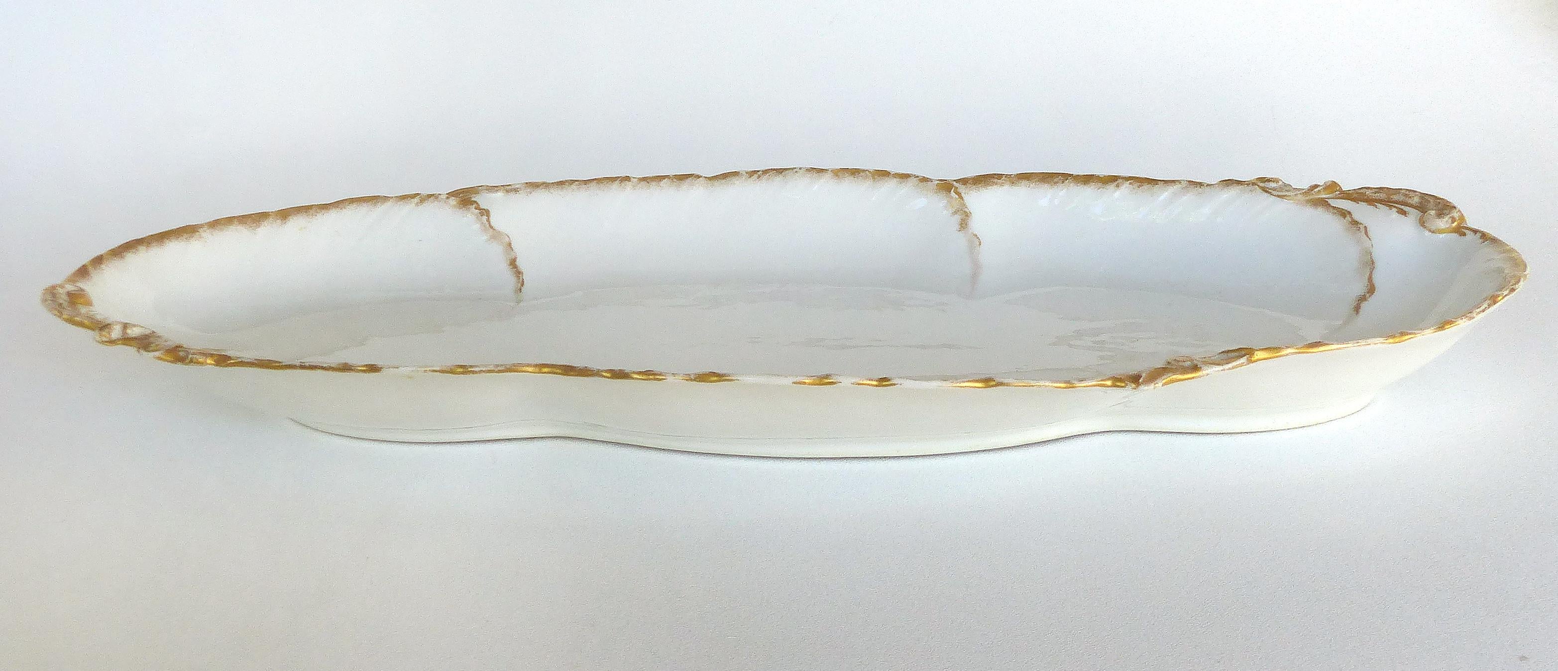 Offered for sale is a William Guerin (W.G. & Co.) Limoges, France oval gilt porcelain serving platter with scalloped edges and gilt detailing. Marked on the underside as pictured.