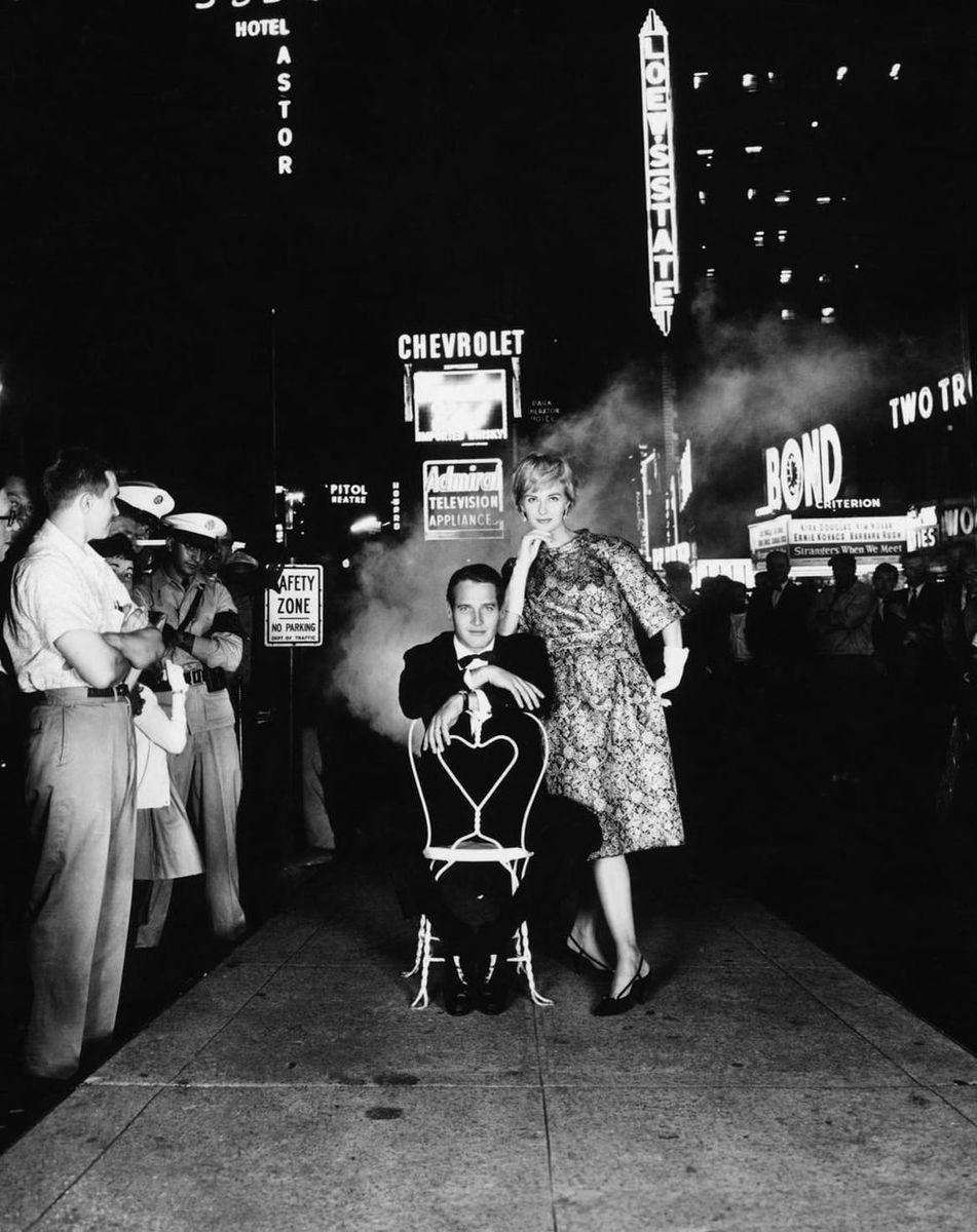 Paul Newman and Joanne Woodward in Times Square - Photograph by William Helburn