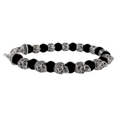 Bracelet de perles pour hommes avec alternance de crânes en argent et d'onyx noir