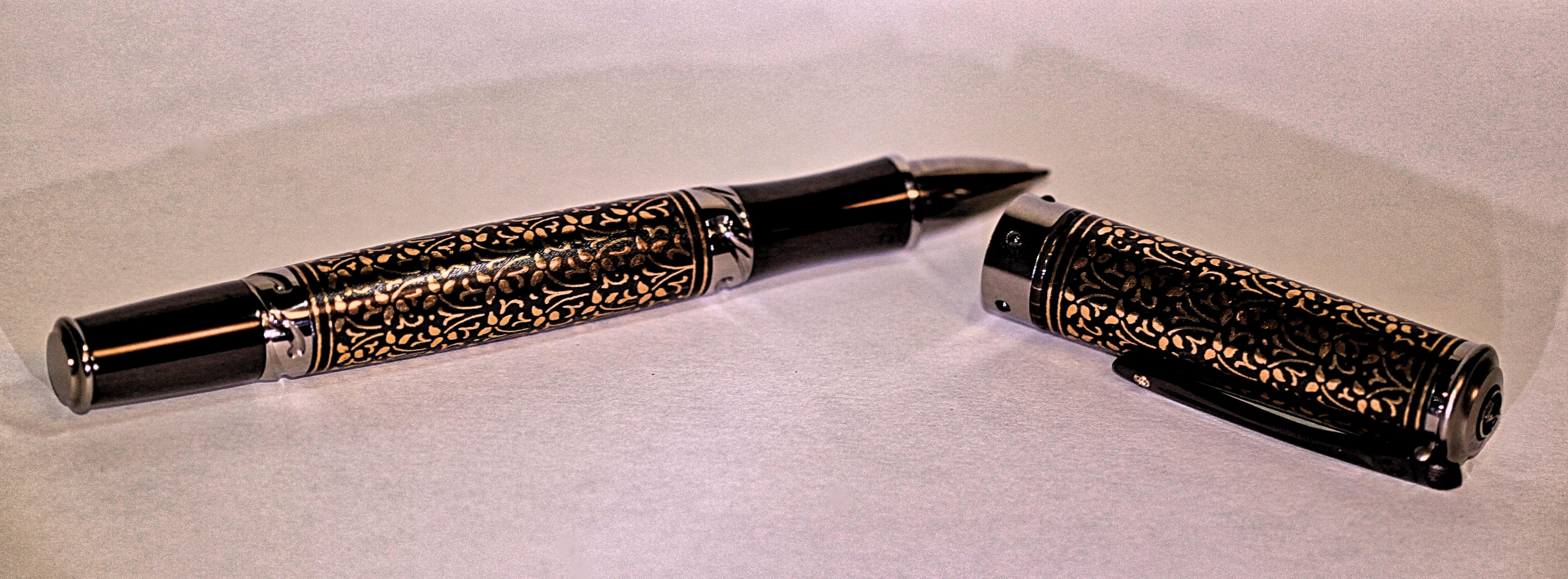The Cabernet Ivy rollerball pen features 24K koftgari, titanium and carbon fiber.  Koftgari is an ancient Indian technique of designing an amazing and unique piece.  The beautiful pen has William Henry's patent-pending Wavelock cap and it is one of