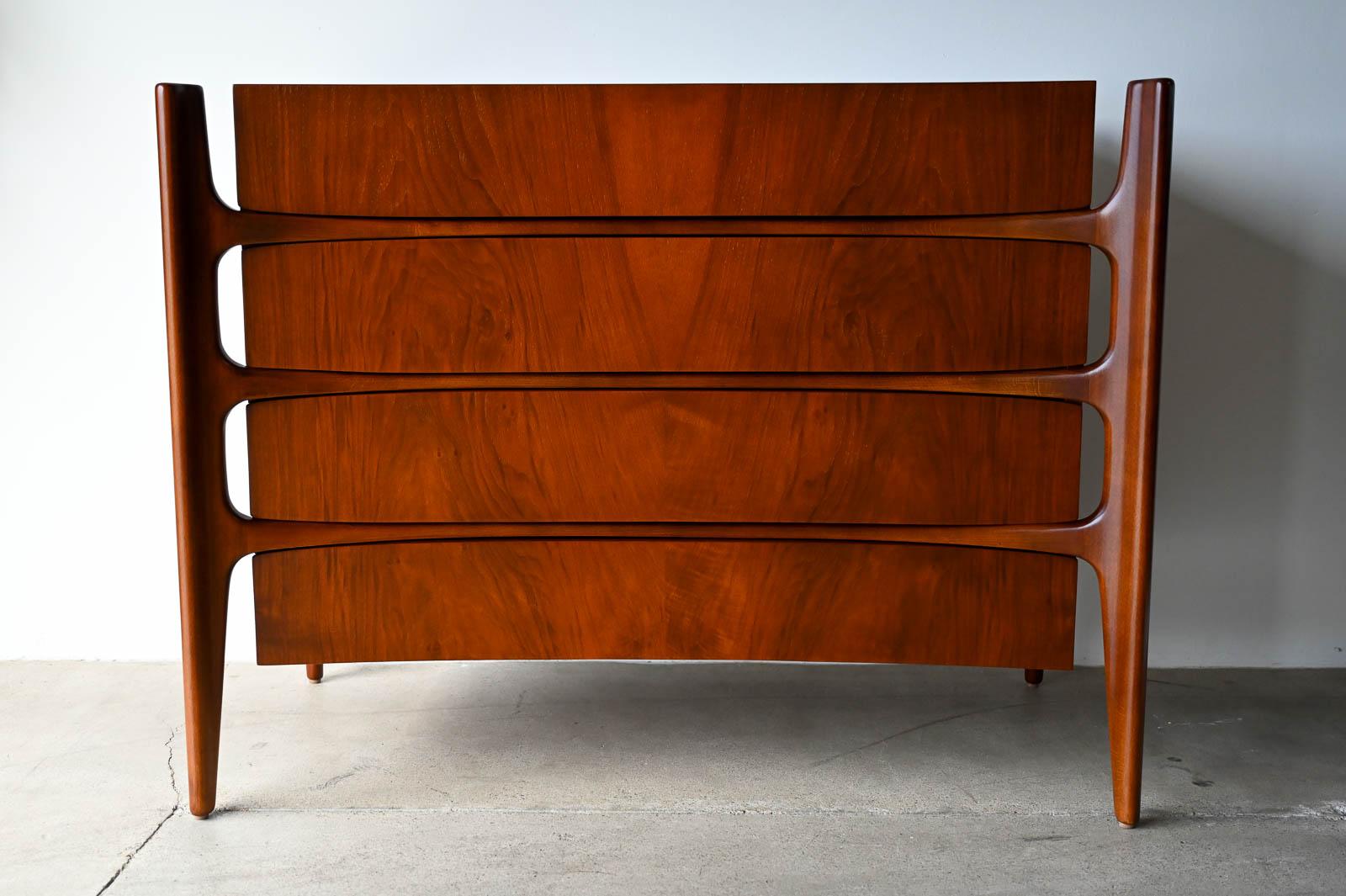 William Hinn  Drawer Chest of Drawers or Cabinet, ca. 1960.  Beautiful 4 drawer cabinet or chest of drawers has a been professionally restored in showroom condition.  Gorgeous walnut grain with floating frame and sculpted legs.  Exceptional piece