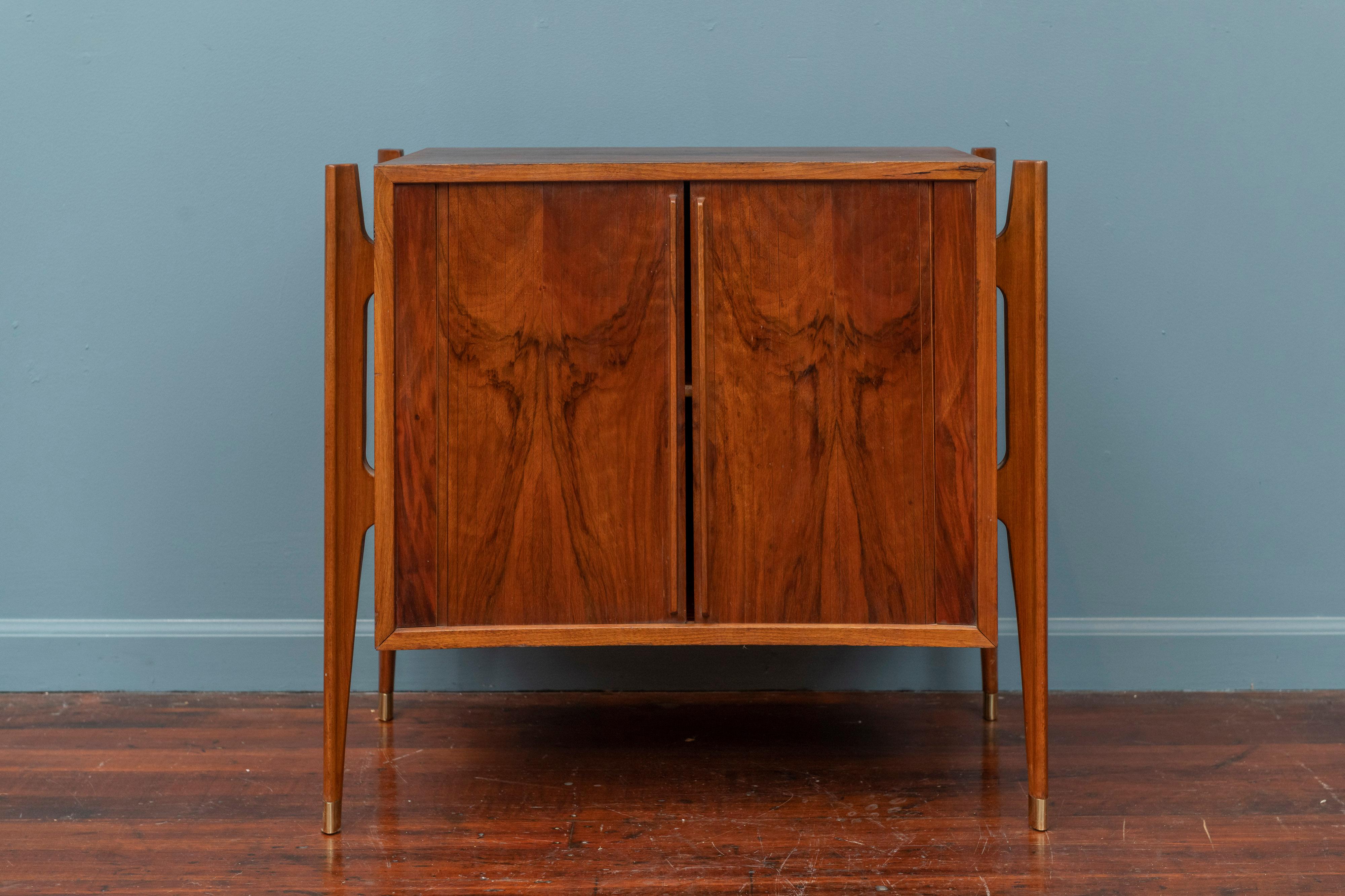 William Hinn Exoskeleton small side table or cabinet for Urban Furniture of Sweden in striking walnut with tambor doors and brass capped legs.