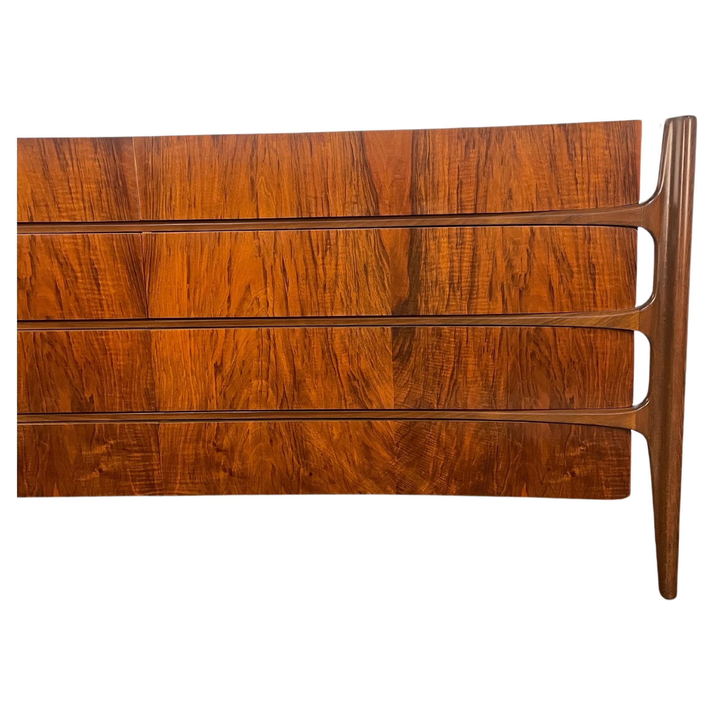 Introducing the rare and stunning William Hinn curved front dresser by The Swedish Furniture Guild for Urban Furniture. This Scandinavian Modern classic has been executed in Black walnut and is  absolutely stunning in person. When the light hits the