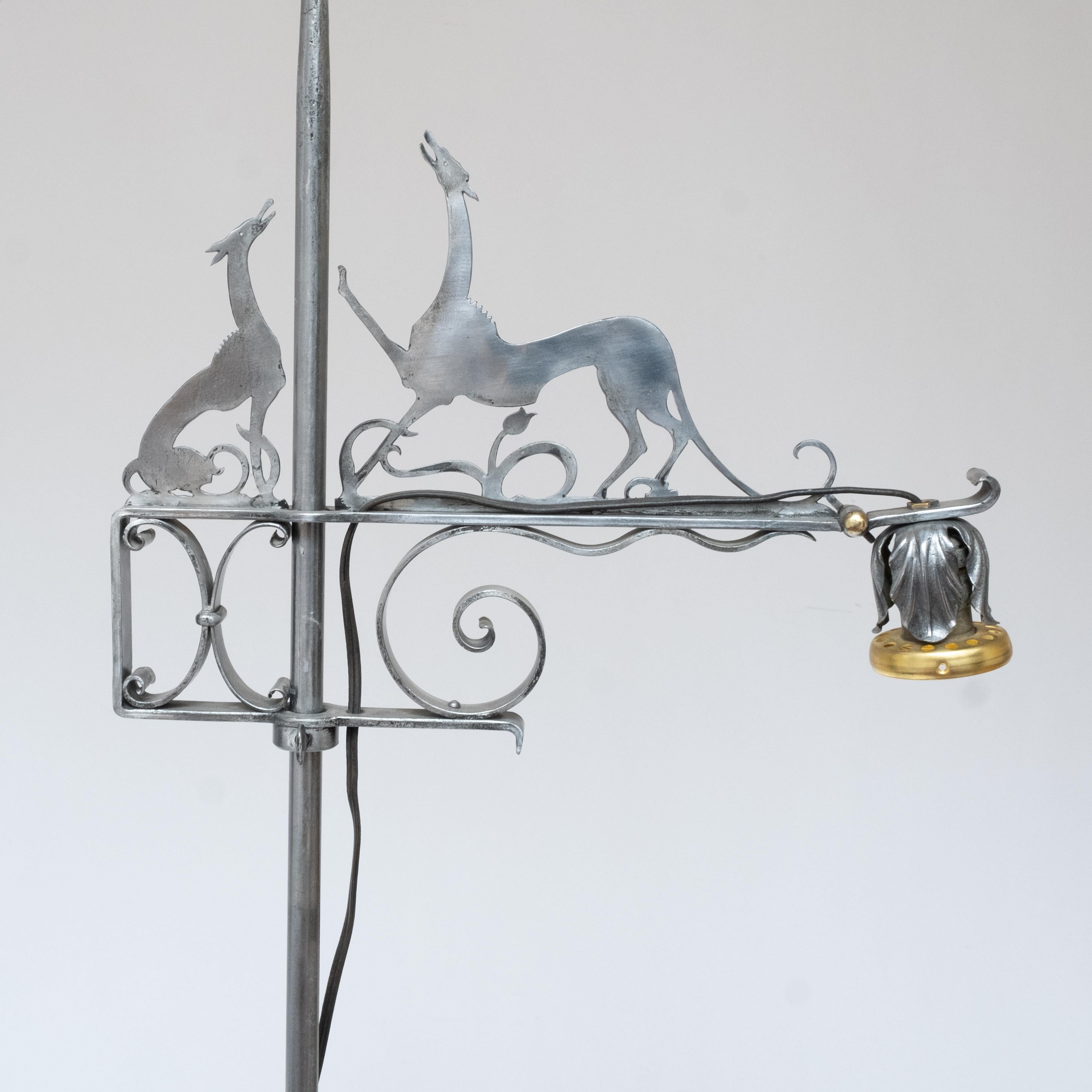 William Hunt Diederich Adjustable height Floor Reading Lamp adorned with Diederich's iconic greyhounds in silhouette formed of cut steel from the collection of noted collector and respected gallery owner, Kenneth Dukoff  of Niagara Falls,