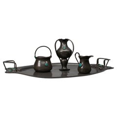 William Hutton, probably for Liberty & Co. An Arts and Crafts four piece tea set