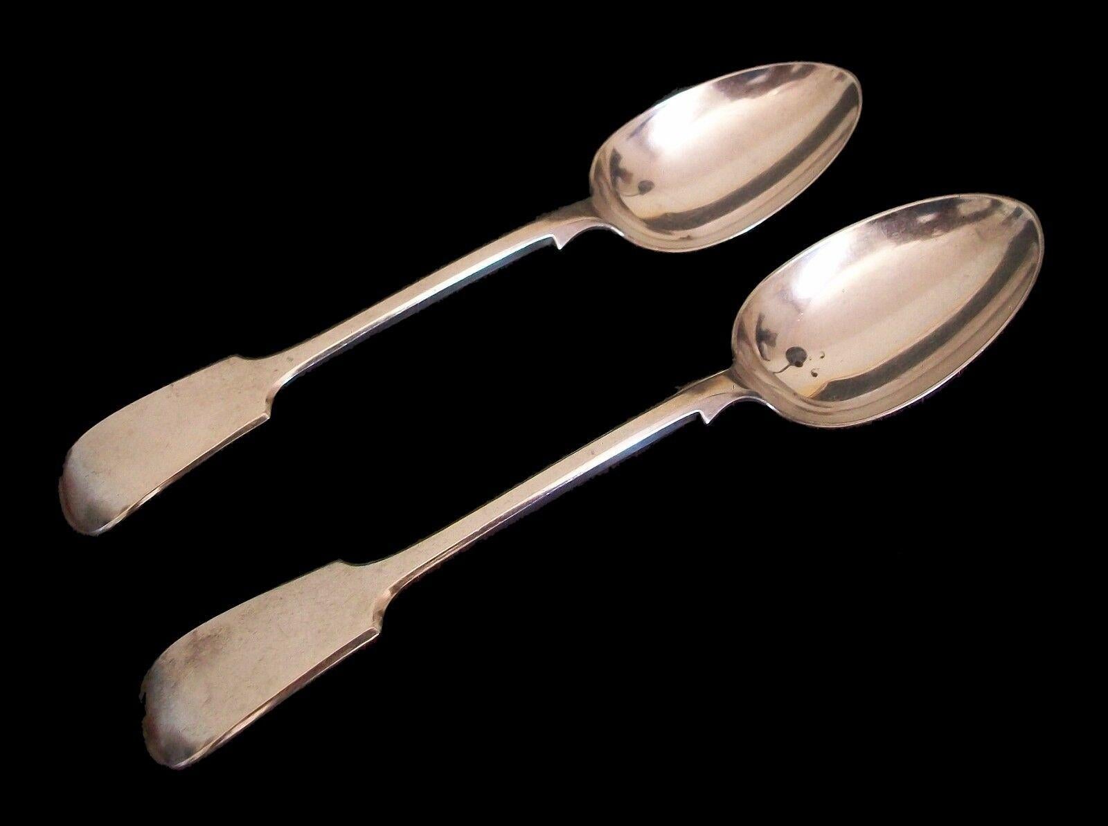 WILLIAM HUTTON & SONS - Antique pair of silver-plate serving spoons - signed on the back of each spoon - United Kingdom - circa 1900.

Excellent antique condition - no loss - no damage - no restoration - tarnishing with scuffs & scratches from age