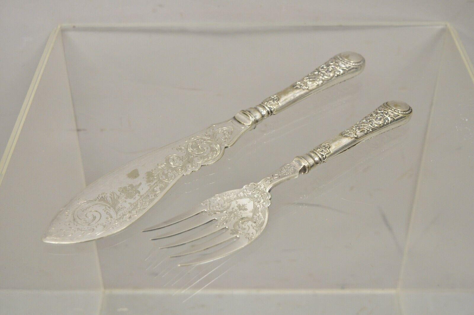 William Hutton & Sons English Victorian silver plated Fish Service Cutlery Set. Item features a (1) serving fork, (1) serving shovel, ornate etchings throughout, original stamp, very nice antique set, quality English craftsmanship. Circa Early
