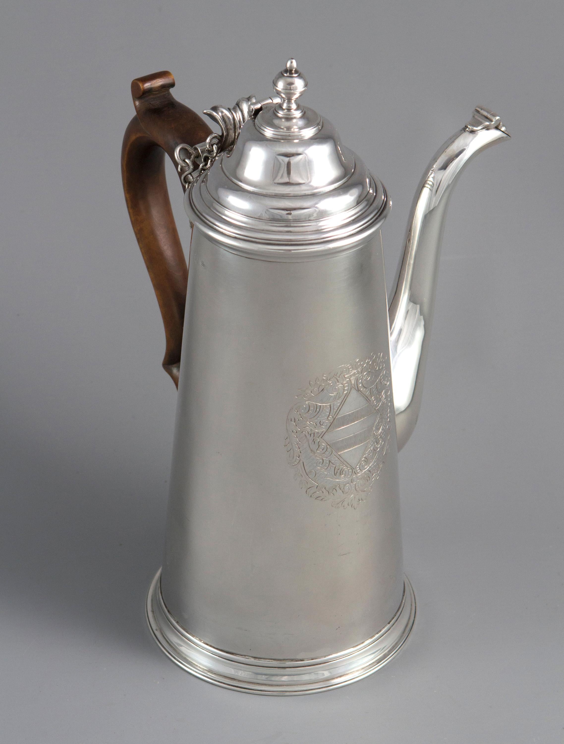 A rare and important William III Britannia silver chocolate pot, London, 1698

A very fine and important William III Britannia standard silver chocolate pot of tapered circular form The stepped domed lid with scroll thumb piece and a separate