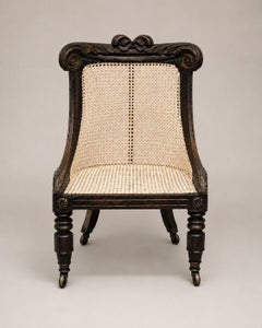 Bibliothekssessel im Bergère-Stil aus dem 19. Jahrhundert, William IV., aus Rosenholz mit geflochtener Sitzfläche, auf originalen Rollen