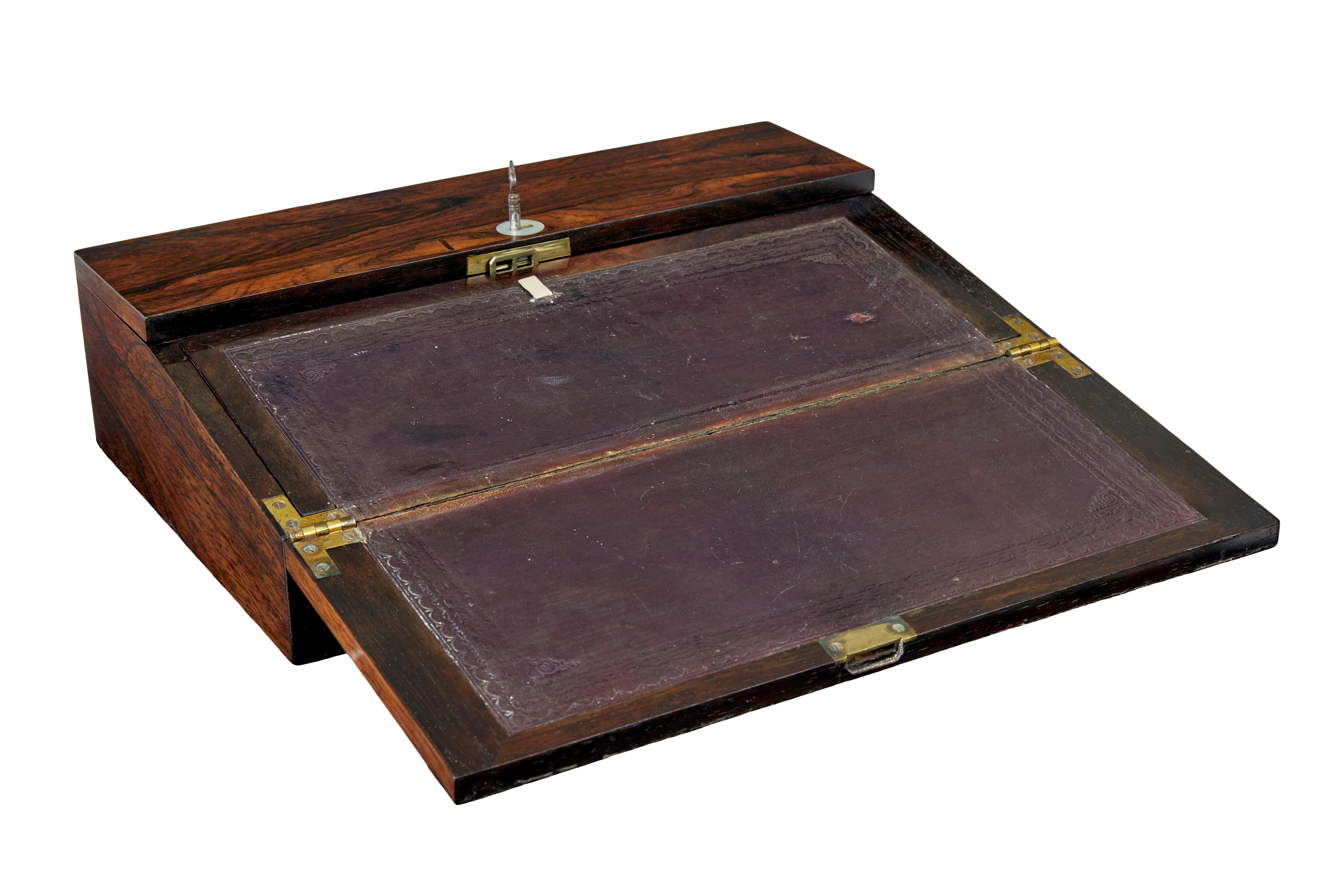 William IV 19th century writing slope circa 1835.

Elegant and good quality William IV rosewood writing slope.

Clean elegant lines, come with original mother of pearl cartouche, named and dated 1835.  Working original lock opens for the lid to come
