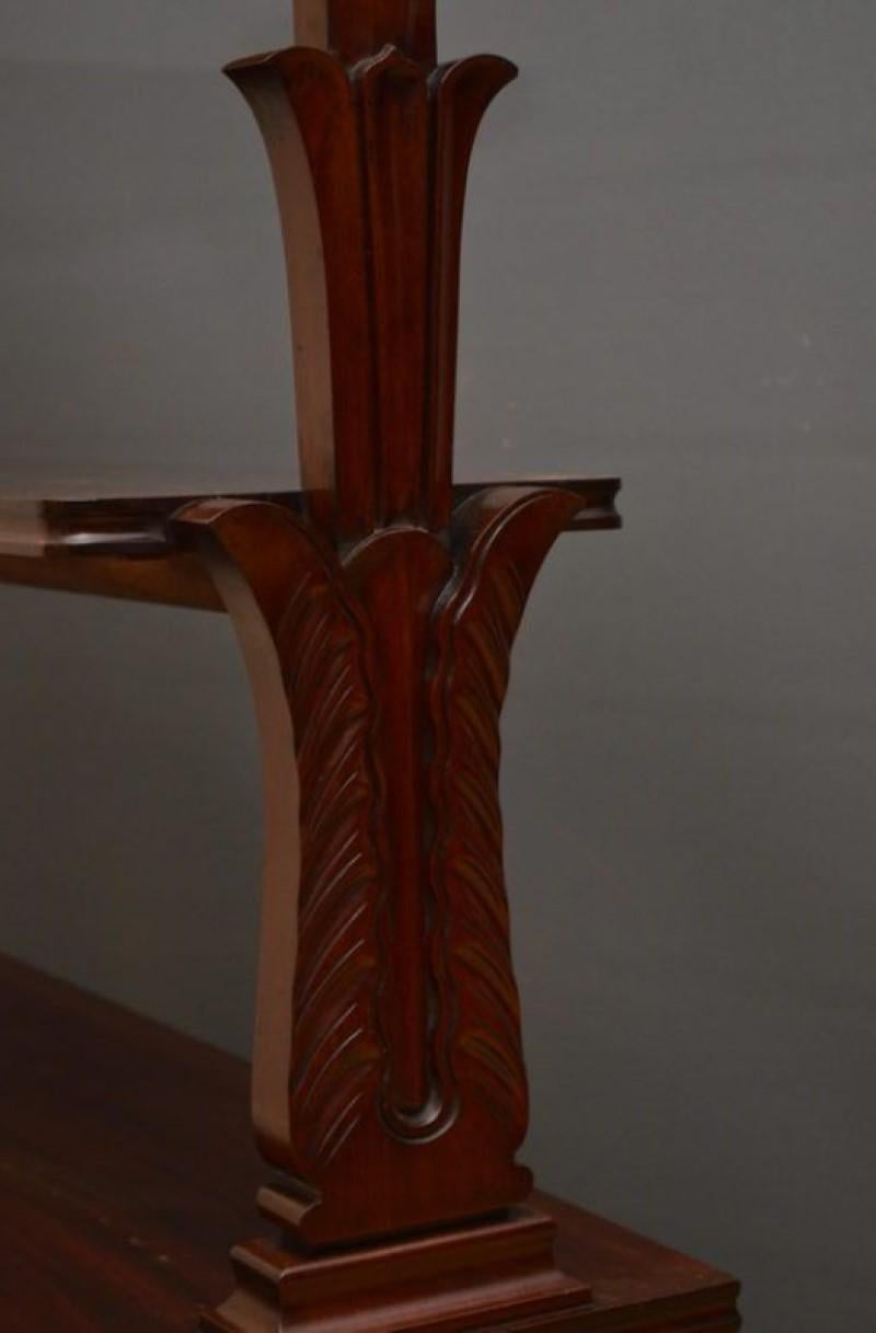 Sn2739 excellent quality, William IV, mahogany freestanding whatnot, having 3 open tiers with moulded edges, shaped end supports carved with scrolls and applied with draught turned roundels, all standing on scroll legs in original castors. This