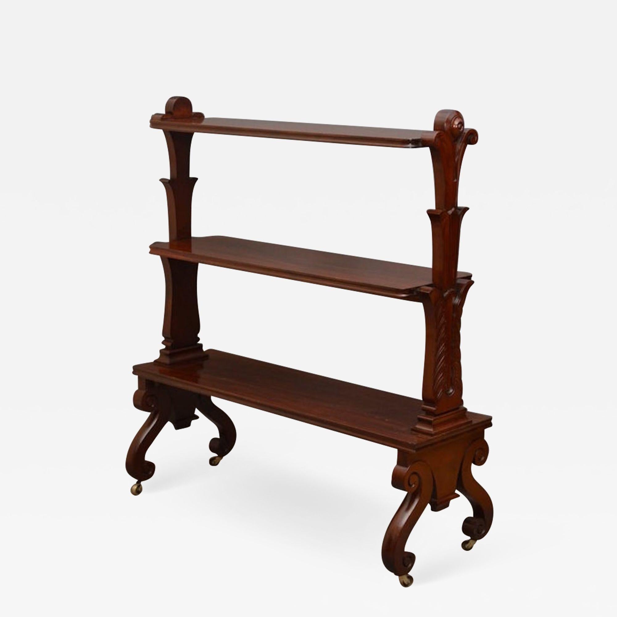 Sn2739 Excellent quality, William IV, mahogany freestanding whatnot, having 3 open tiers with moulded edges, shaped end supports carved with scrolls and applied with draught turned roundels, all standing on scroll legs in original castors. This