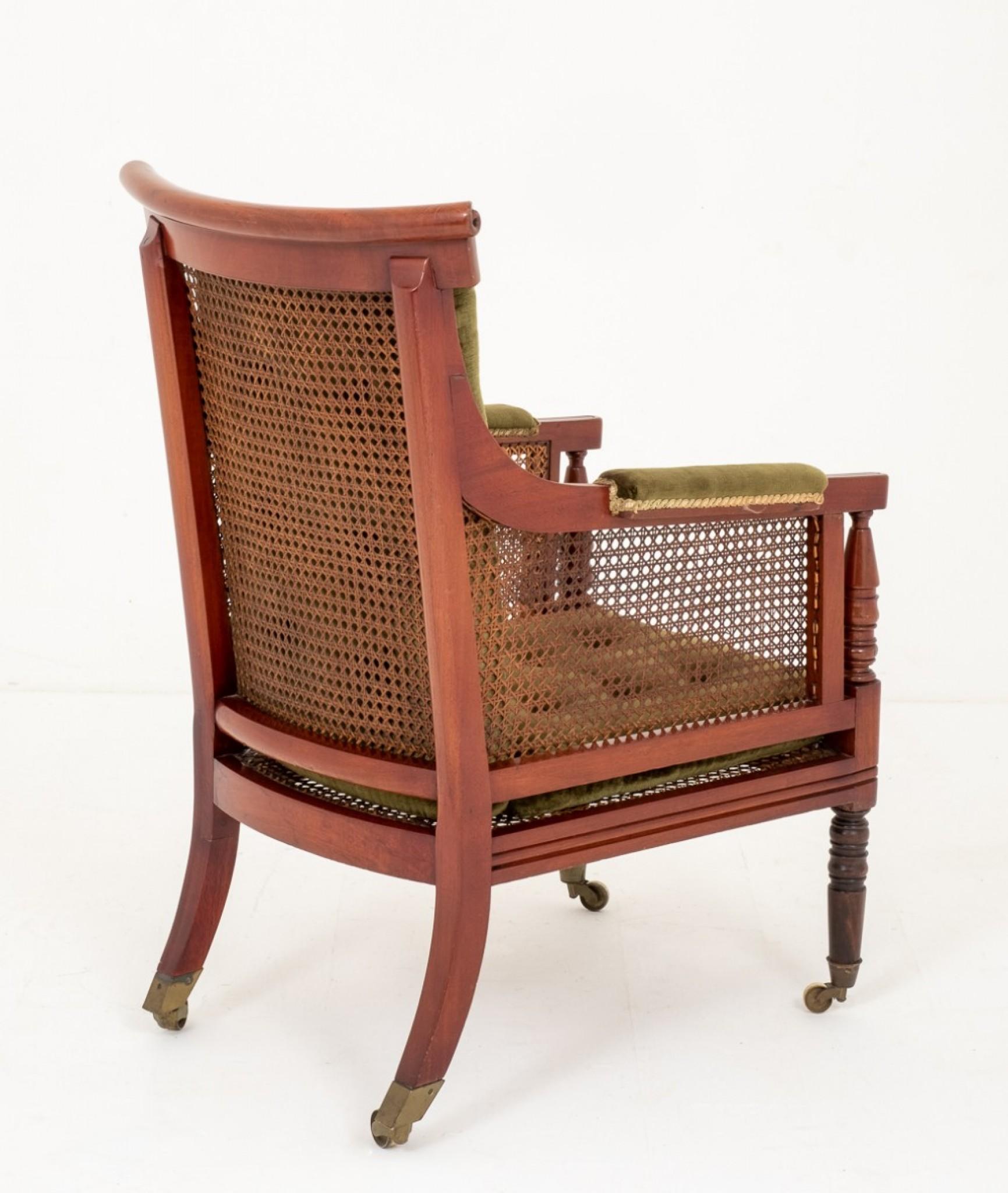 Impressive Mahogany William IV Bergere Chair.
19th century
Having Ring turned front legs with brass castors and sabre back legs.
Turned Arm supports and reeded Arms.
The Cresting rail being of a shaped form.
In good condition with lift out