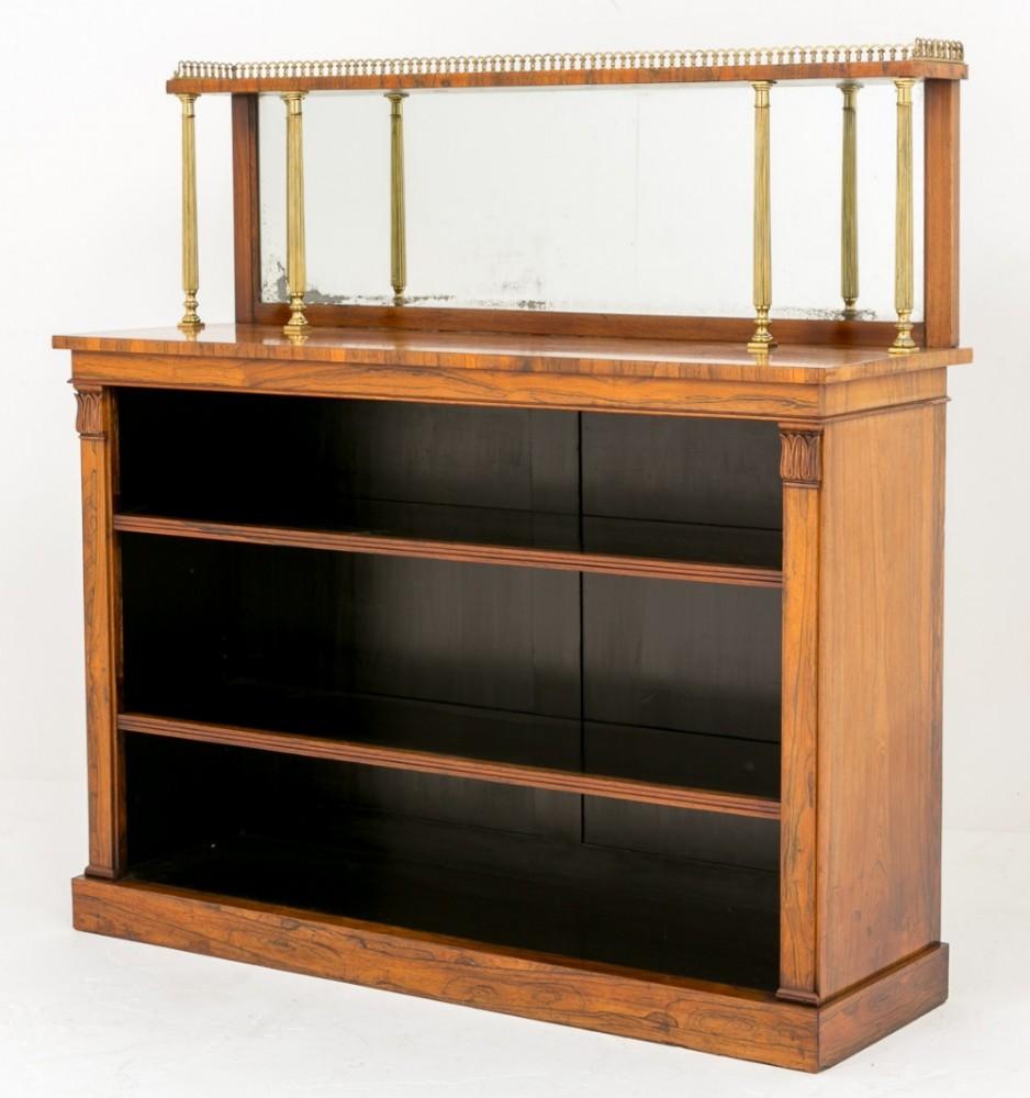 Stunning William IV Rosewood bookcase.
19th Century
Standing on a plinth base with 2 x adjustable shelves flanked by 2 x columns with typical William IV Carvings.
The superstructure having 4 x fluted brass columns, brass gallery and the original