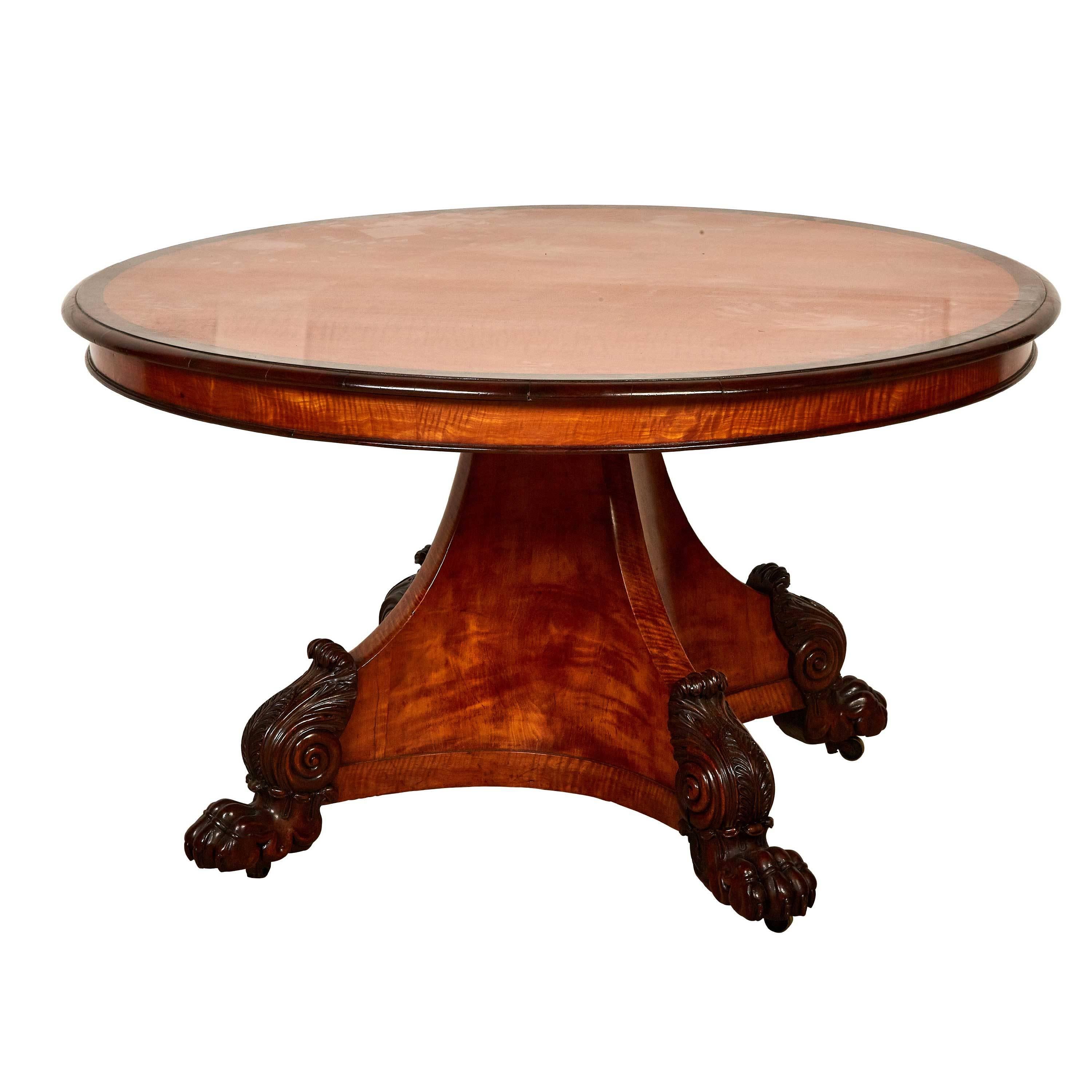 Very unusual breakfast table, satinwood with large mahogany lions paw feet.

William IV. 1830-1837.