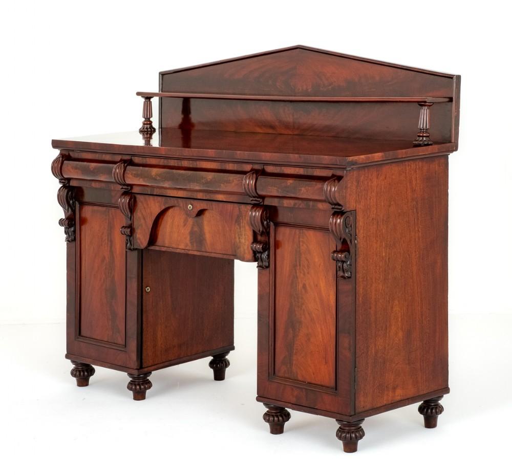William IV Mahogany Sideboard.
19th century
This Sideboard is Raised Upon Turned and Fluted Feet.
Having an Arrangement of 2 Cupboards and 4 Oak Lined Drawers.
The Whole of The Sideboard Featuring Quality Flame Mahogany Timbers.
The Doors Open