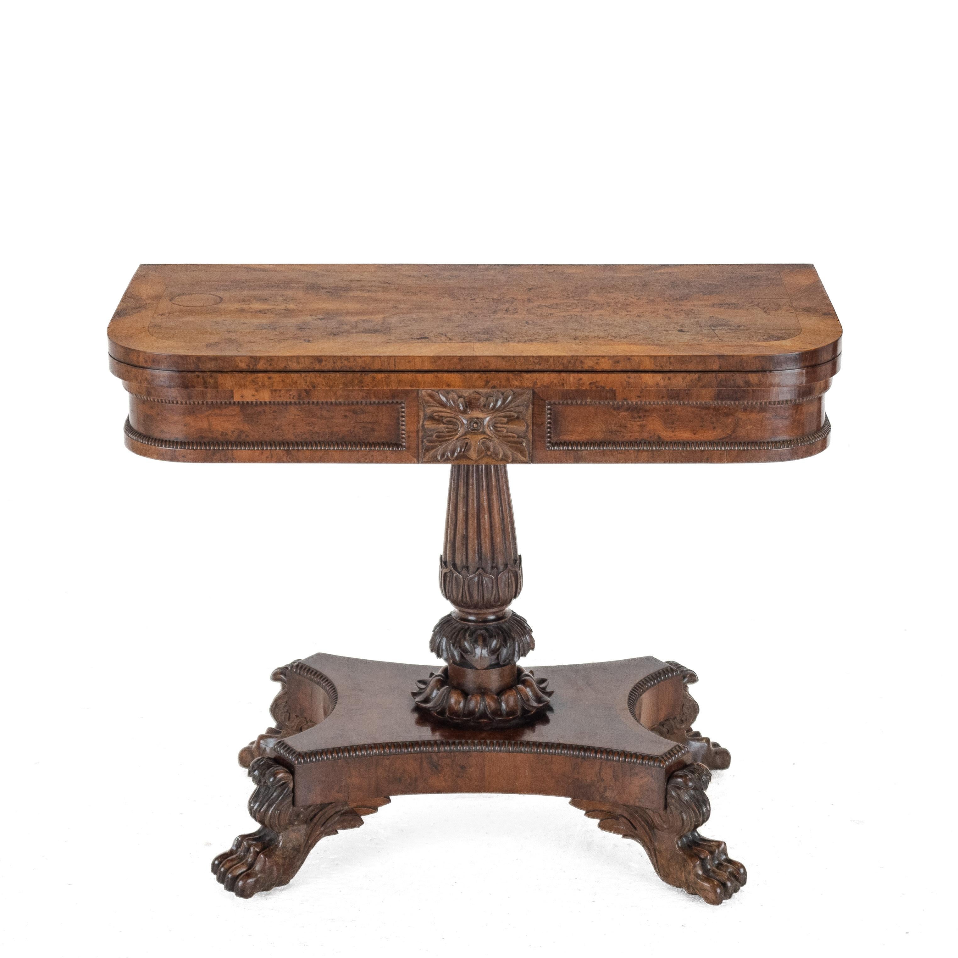William IV Burr Yew Card Table on Carved Lion Paw Base, c.1830

A magnificent William IV card table of exceptional quality, crafted in beautifully figured burr yew with deep, lively grain and a rich, warm patina. The fold-over top is veneered in