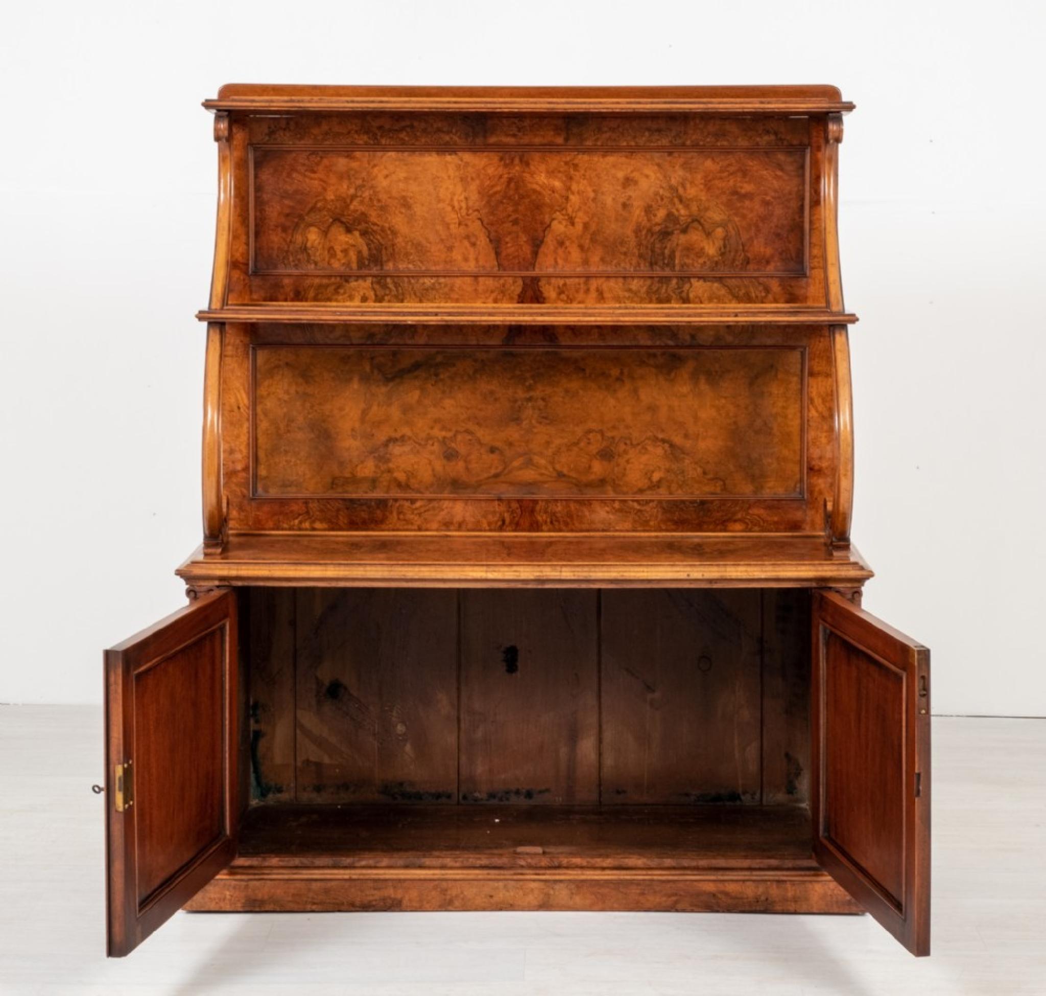 A very unusual William IV side cabinet featuring the highest quality burr walnut veneers
Period William IV - 19th century
Standing upon a plinth base with 2 working cupboards
The cupboards are flanked by pilasters with carved corbels
The super