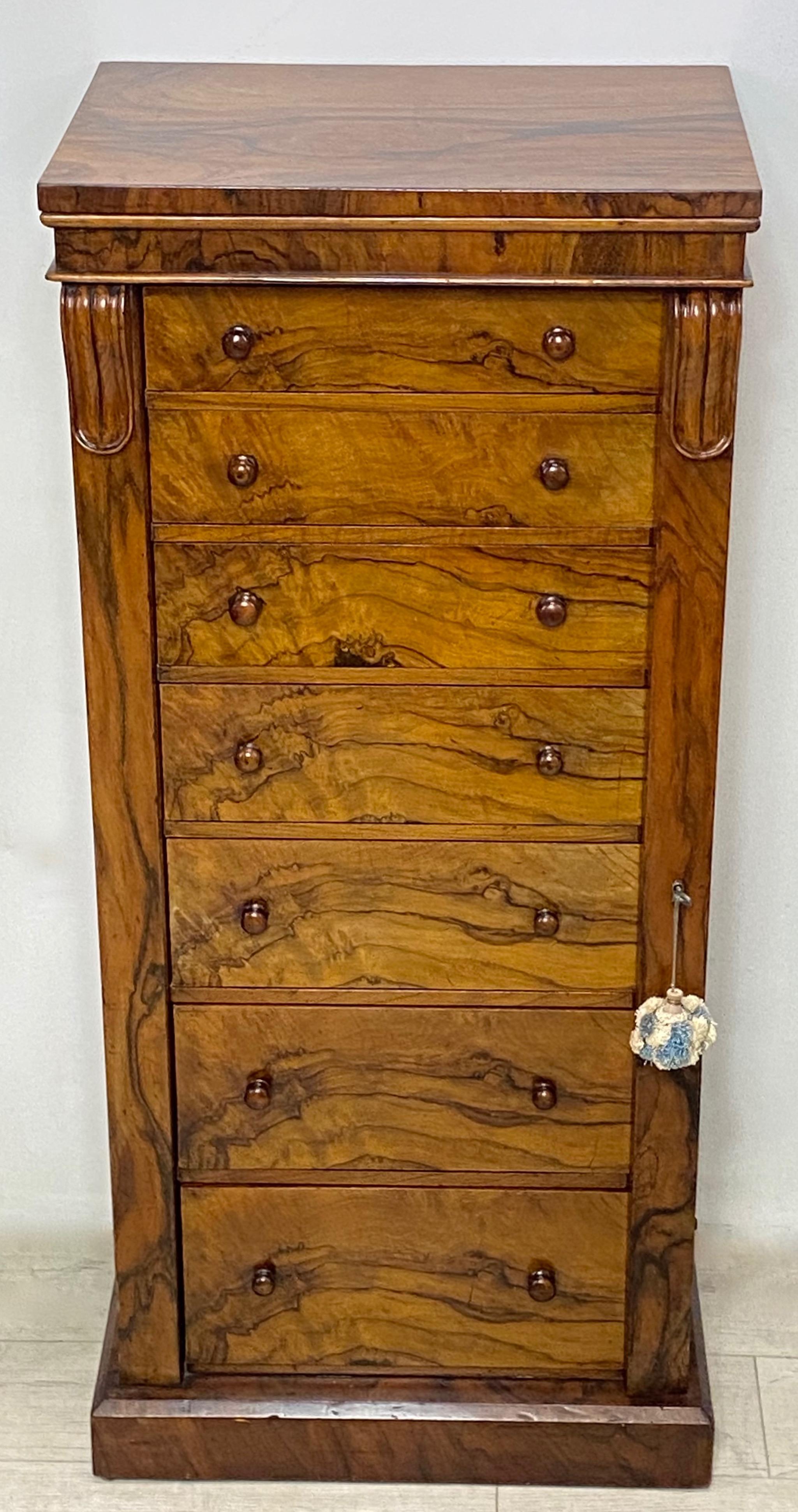 An unusual diminutive size side William IV style side-locking lingerie cabinet or semainier. Made of circassian walnut over mahogany, the drawer interiors are solid mahogany.
1st half of the 19th century, England.
This seven drawer chest was