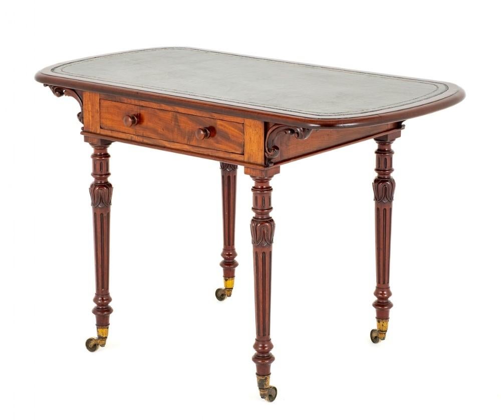 Here we Have an Excellent Quality William IV Mahogany Writing Table.
Raised Upon Ring Turned and Fluted Legs which Feature The Typical William IV Tulip.
19th Century
Having One Mahogany Lined Drawer (note the fine dovetails)
The Top of the Table