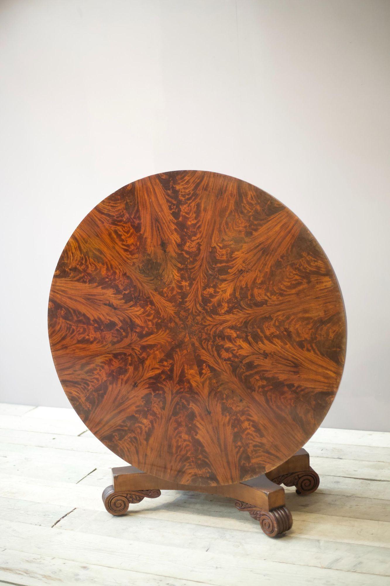 This is a striking early 19th century William IV flame mahogany centre table. The top of the table is stunning, the way the veneer has been placed really shows the quality of the work and care taken to make such an impactful finish. What I like