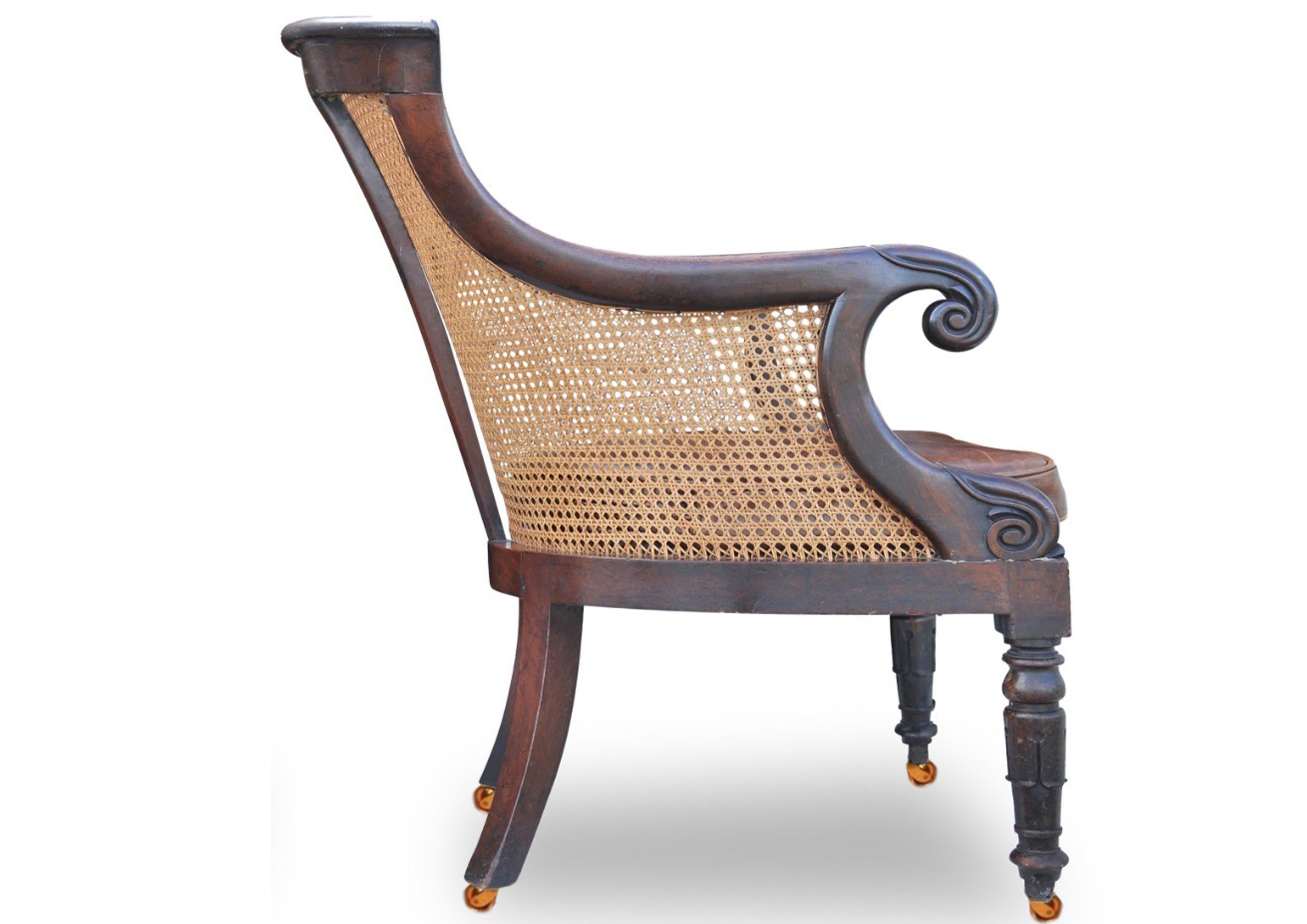 19th Century William IV Hardwood Cane Bergere Library Armchair With Scrolled Arms on Castors For Sale