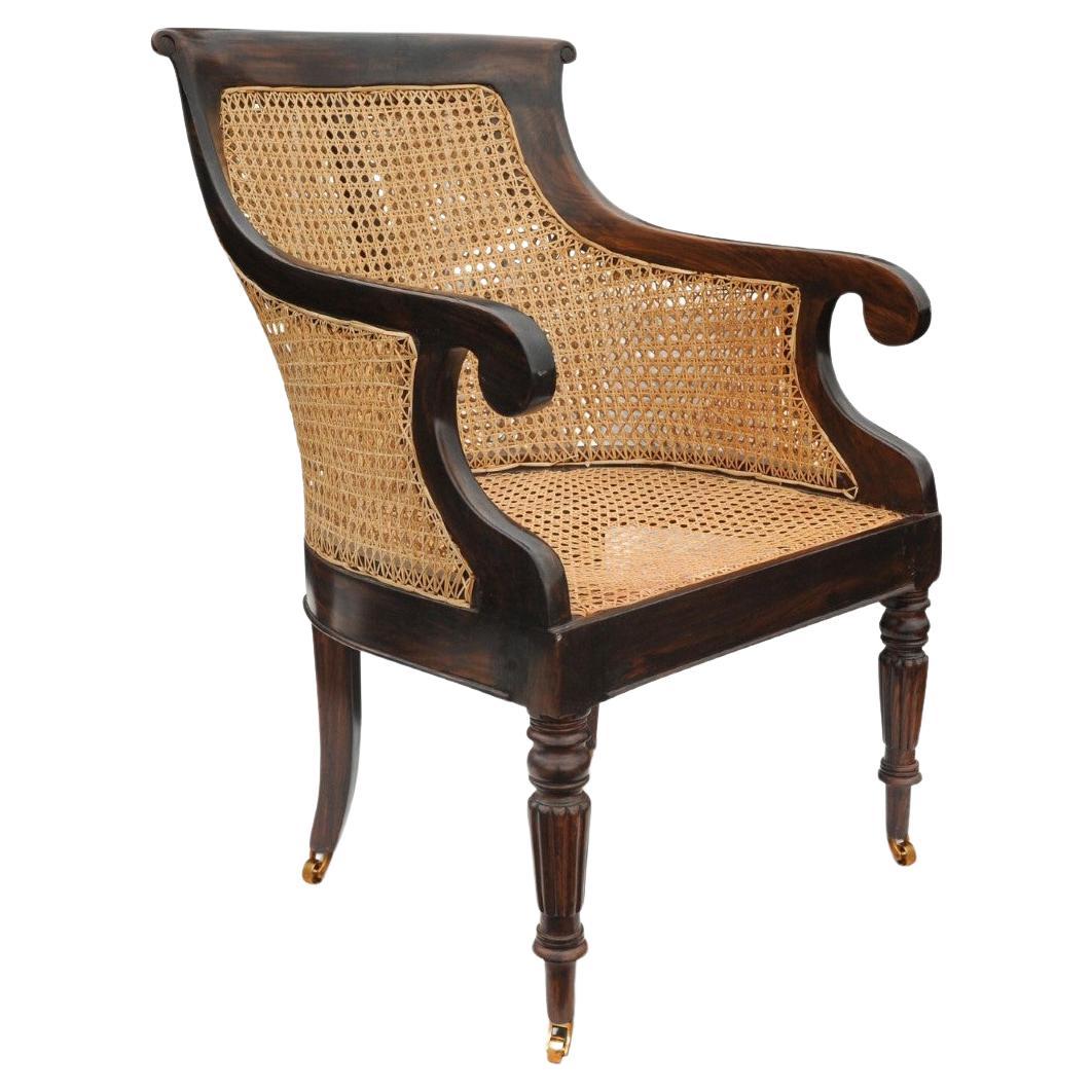 Fauteuil de bibliothèque William IV en bois dur Cane Bergere avec accoudoirs à volutes sur roulettes en vente