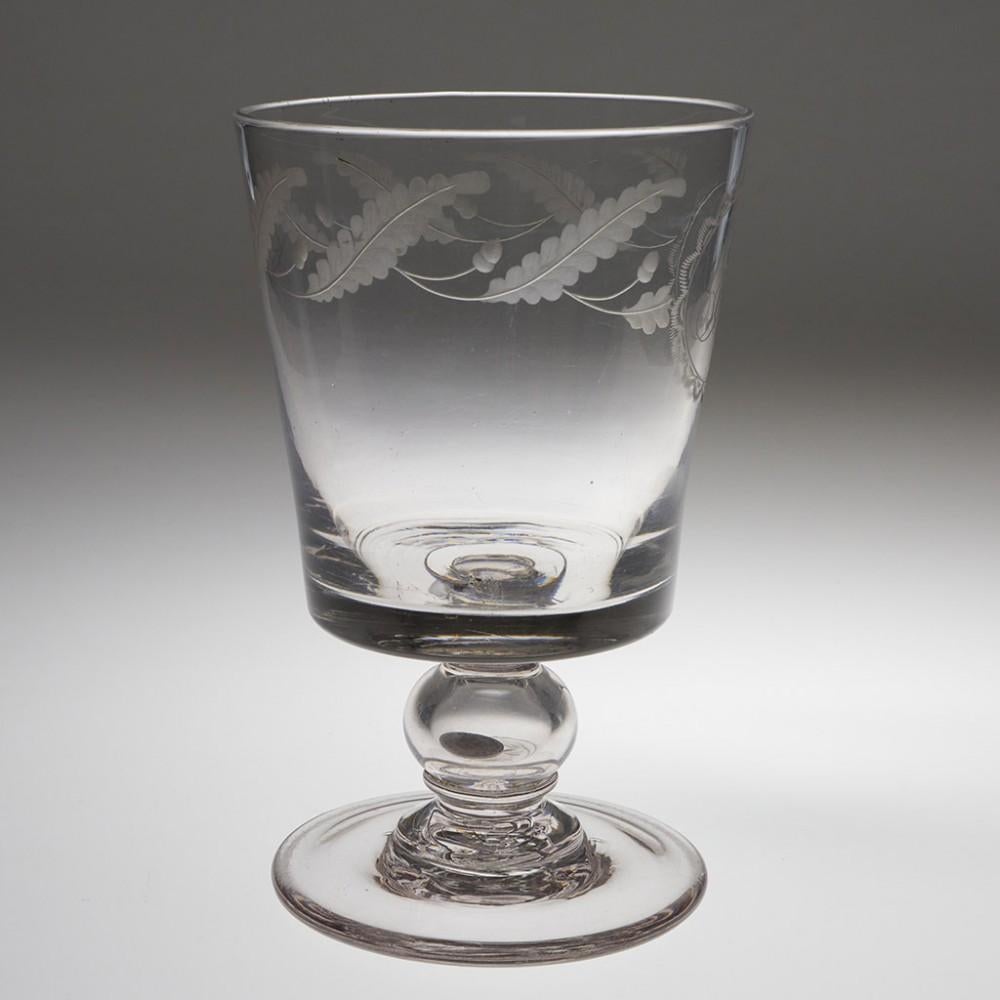 Heading : William IV Coin Goblet
Period : William IV- Victoria
Origin : England
Colour : Clear, excellent grey tone
Bowl : Bucket shaped. Engraved oak leaves and acorns and monogram IJ
Stem : Small blade merese above a hollow ball knop containing a