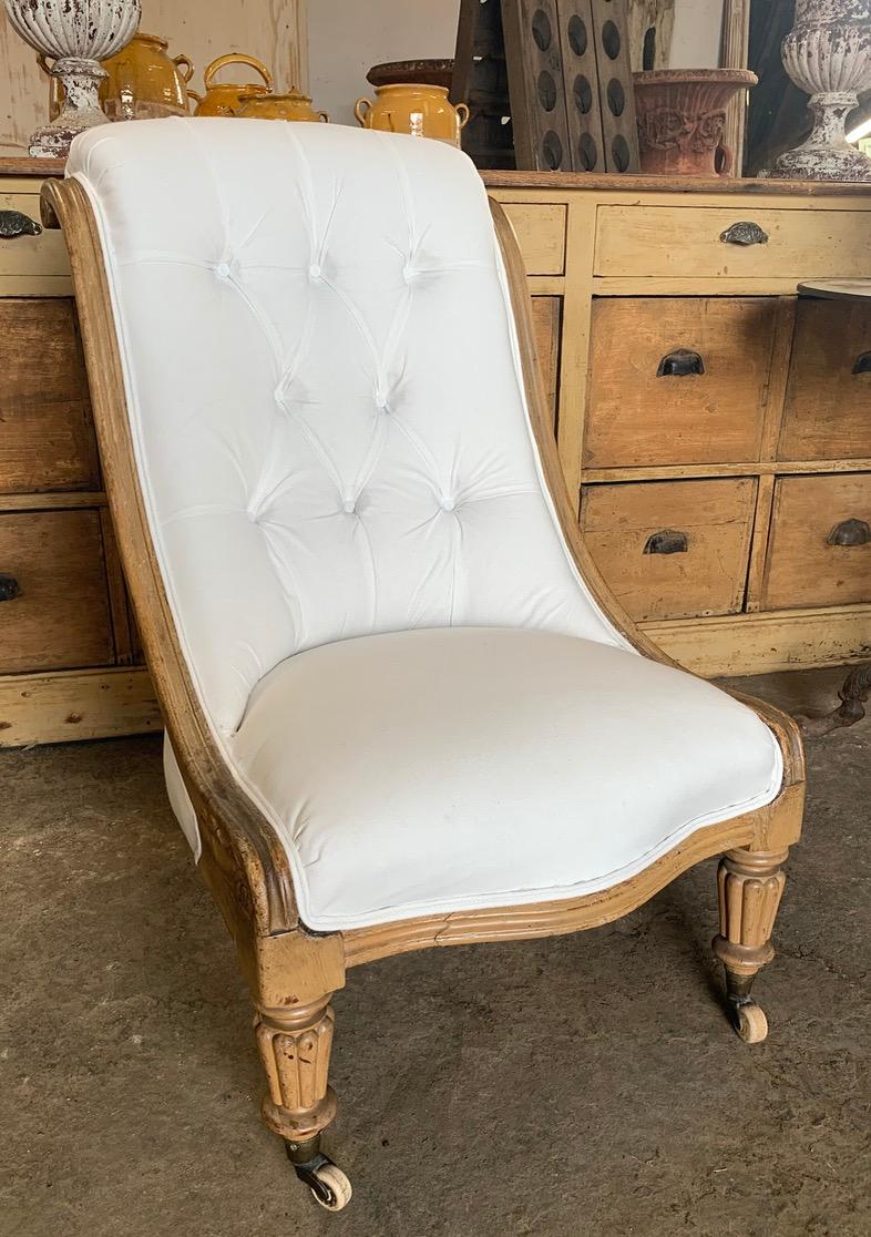 A beautiful English William IV Library chair which has a lovely shape with the scroll back. It has been newly upholstered with Calico Fabric. Wear to the frame in places from age and use. 
Please contact us for an accurate shipping quote.