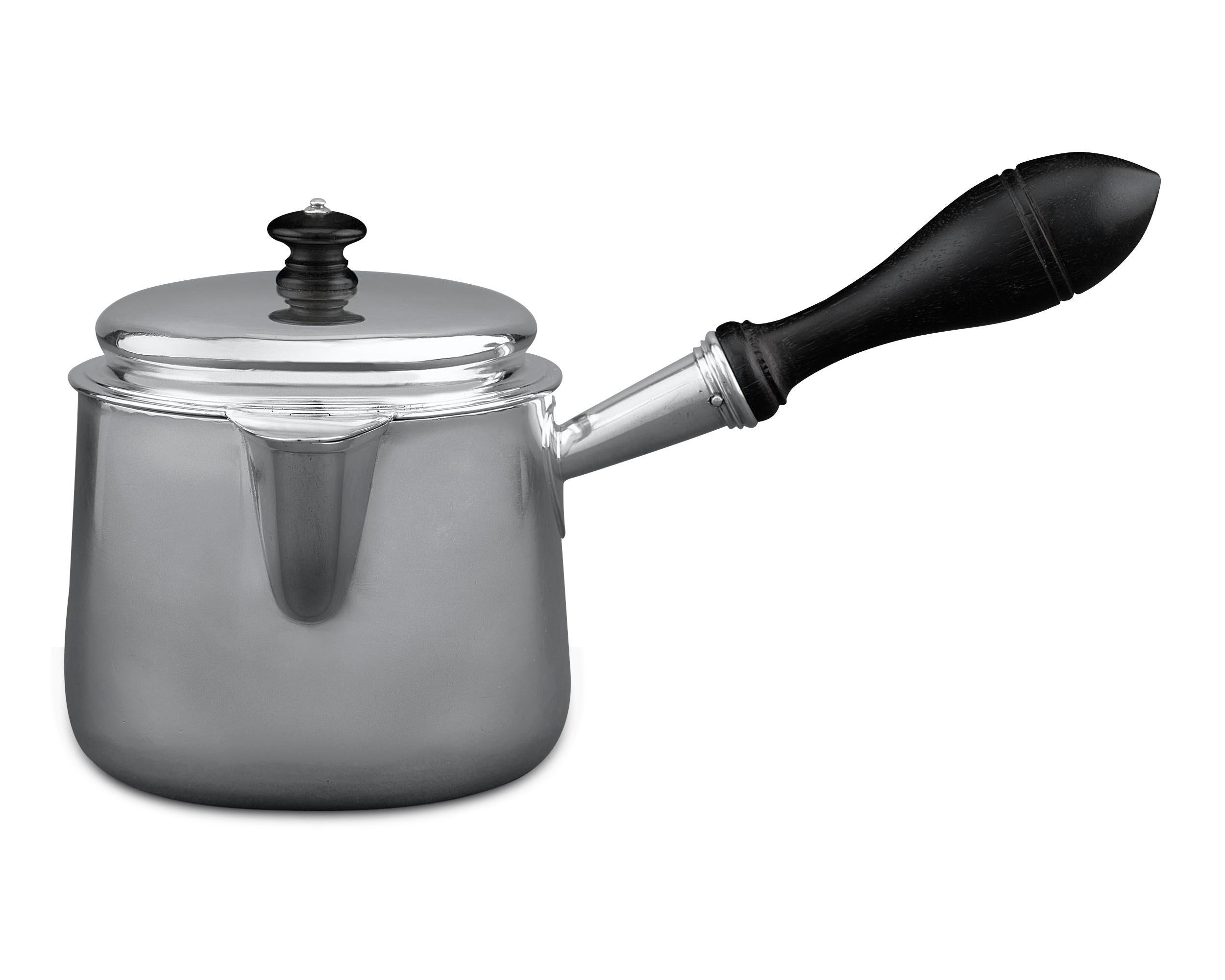 Classic, understated elegance defines this English William IV-period silver pot. Crafted by Richard Sibley, this lidded, single-handled pot was used to warm brandy, which was done to release the different flavors and aromas of this fine spirit. A