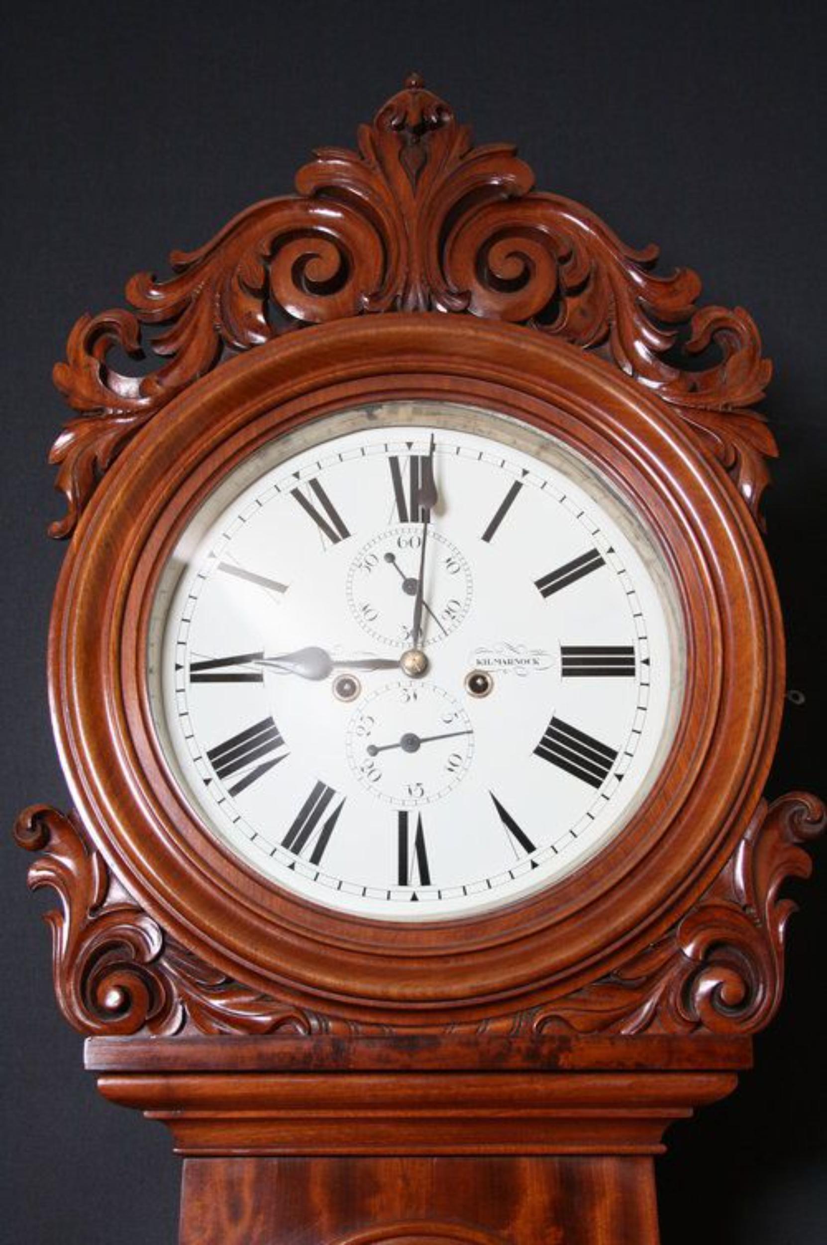 Sn2087 Truly excellent, William IV- Scottish, mahogany drumhead, longcase clock, having well defined carvings to hood, white painted dial with day of the month and second dial, arched, panelled trunk, terminating in flamed mahogany, panelled base