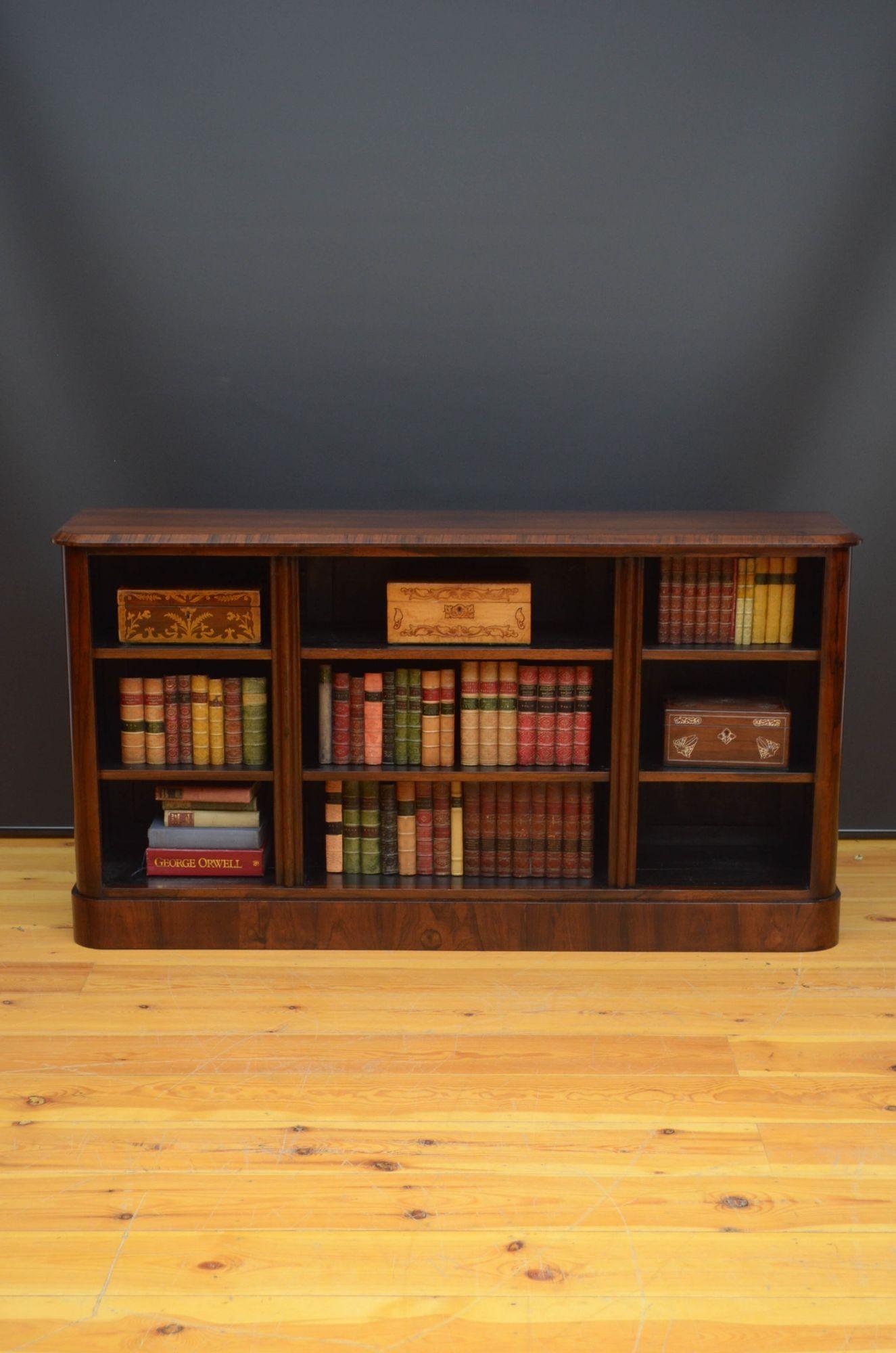 Sn5426 Fine quality William IV / Early Victorian low bookcase, having oversailing top with attractive rosewood grain above three open section each with two height adjustable shelves, flanked by shaped pilasters and rounded corners, all standing on