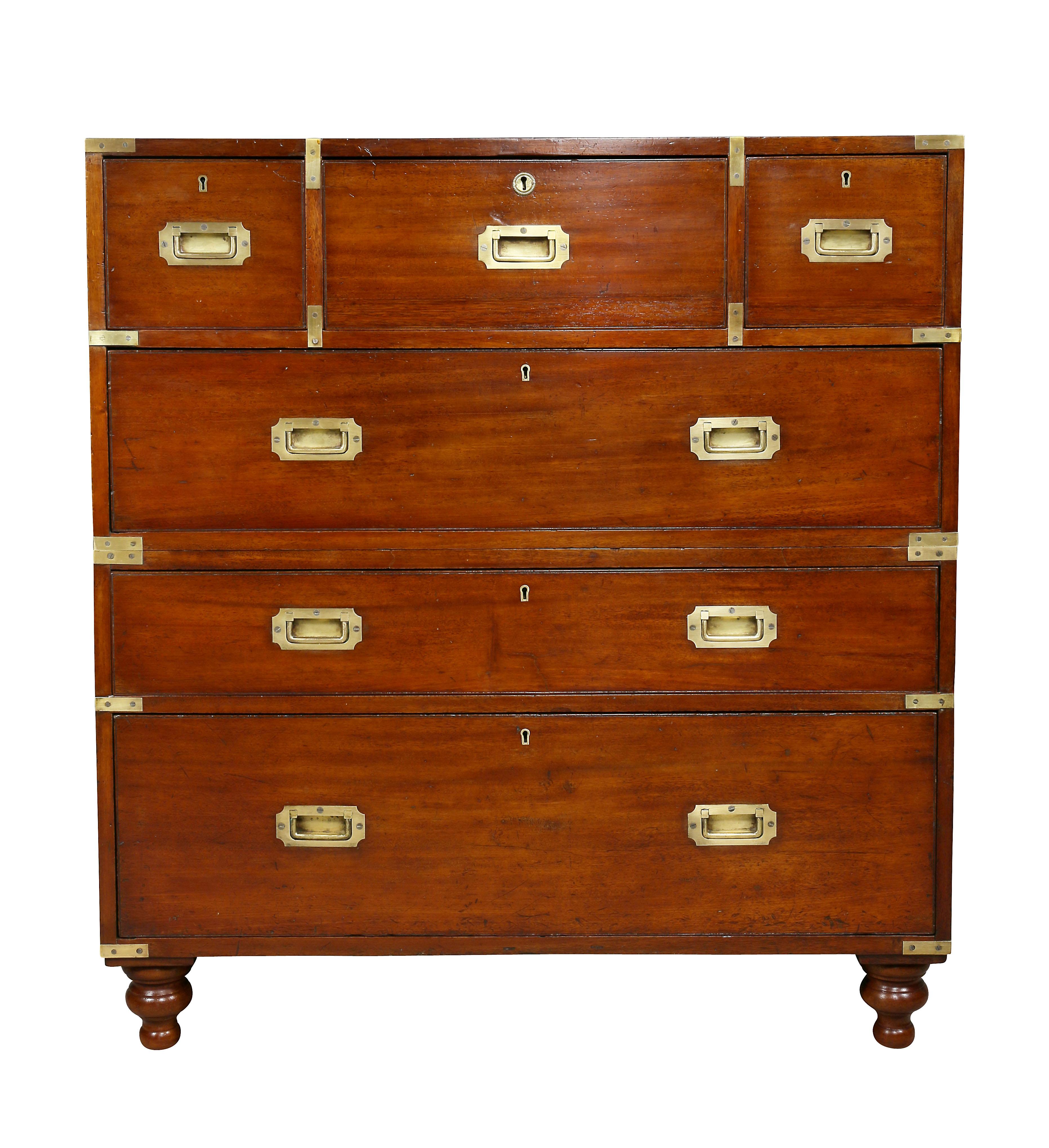 In fine condition, two part with rectangular top over three drawers, the central one finely fitted with a fold down burl walnut desk with black leather writing surface, below three drawers all fitted with recessed handles, toupie feet.