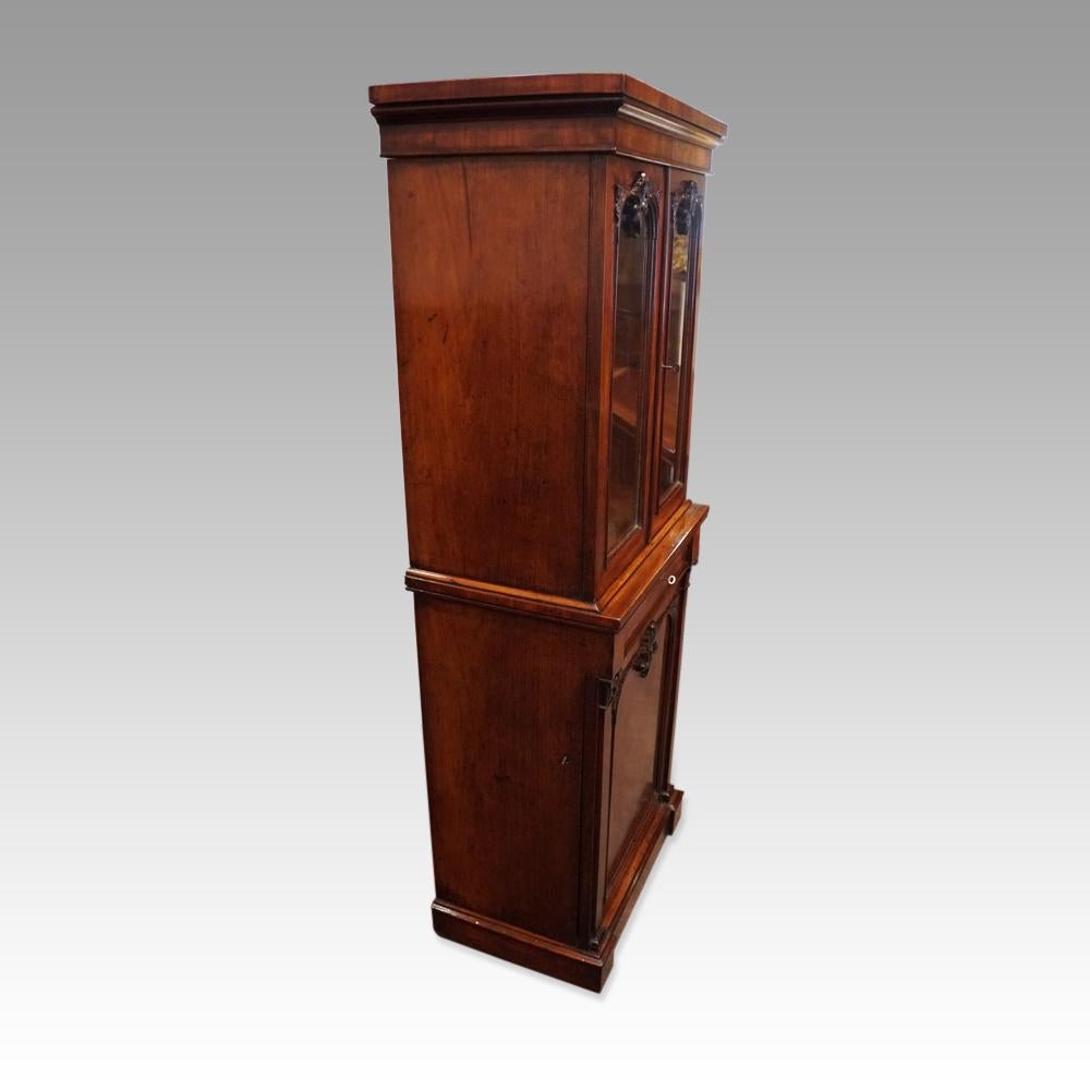 This William IV mahogany fitted bookcase was made circa 1830.
It is a rare piece as not only is it of a lovely small size, but the base cupboard is also fitted with drawers and pigeon-holes. 
The upper section has a pair of glazed doors with the