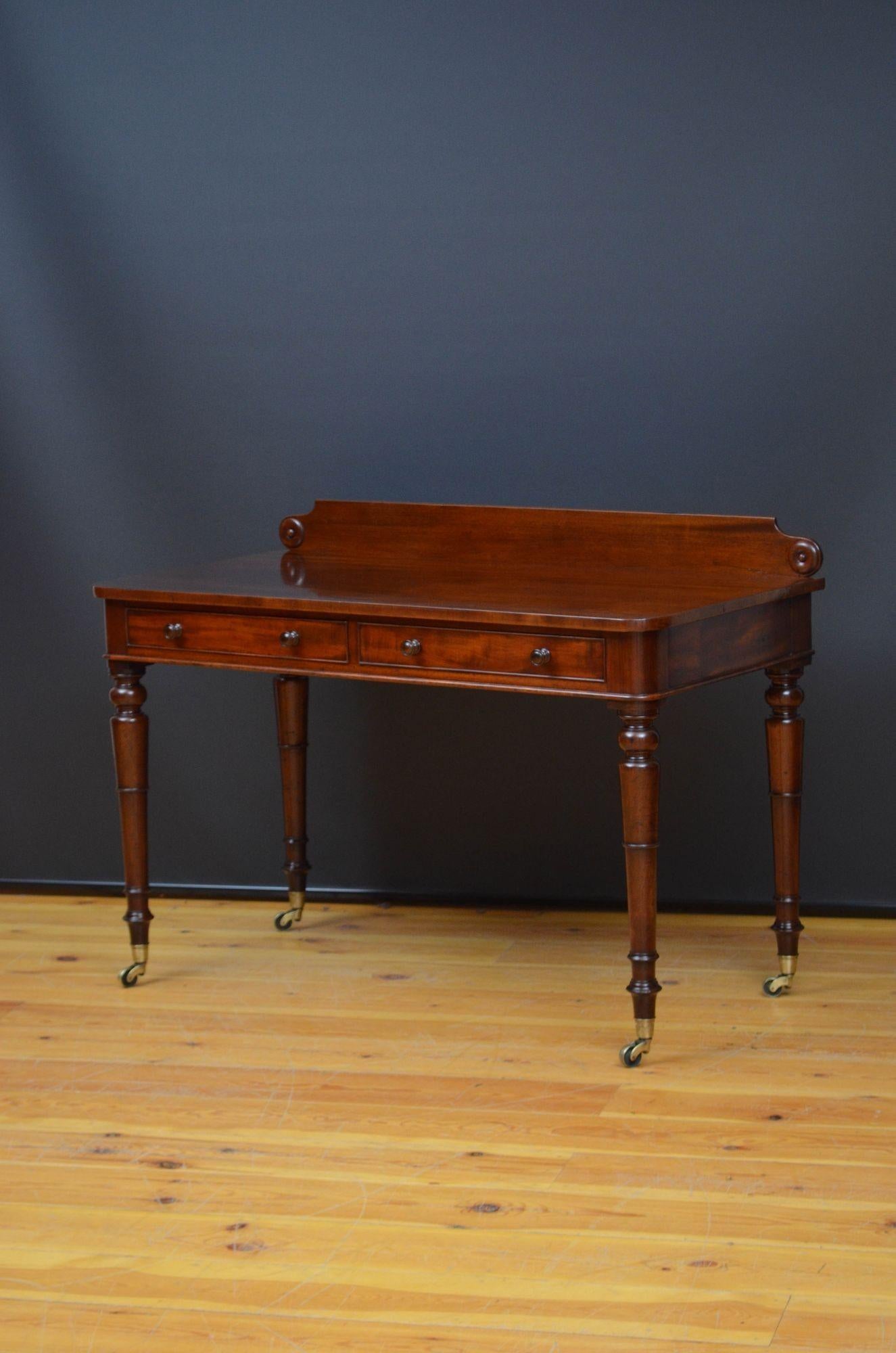 Sn5547 Fine quality and very attractive William IV figured mahogany dressing table / writing table, having shaped and carved upstand to the back edge, figured top and two mahogany lined cockbeaded drawers fitted with turned knobs, all standing on