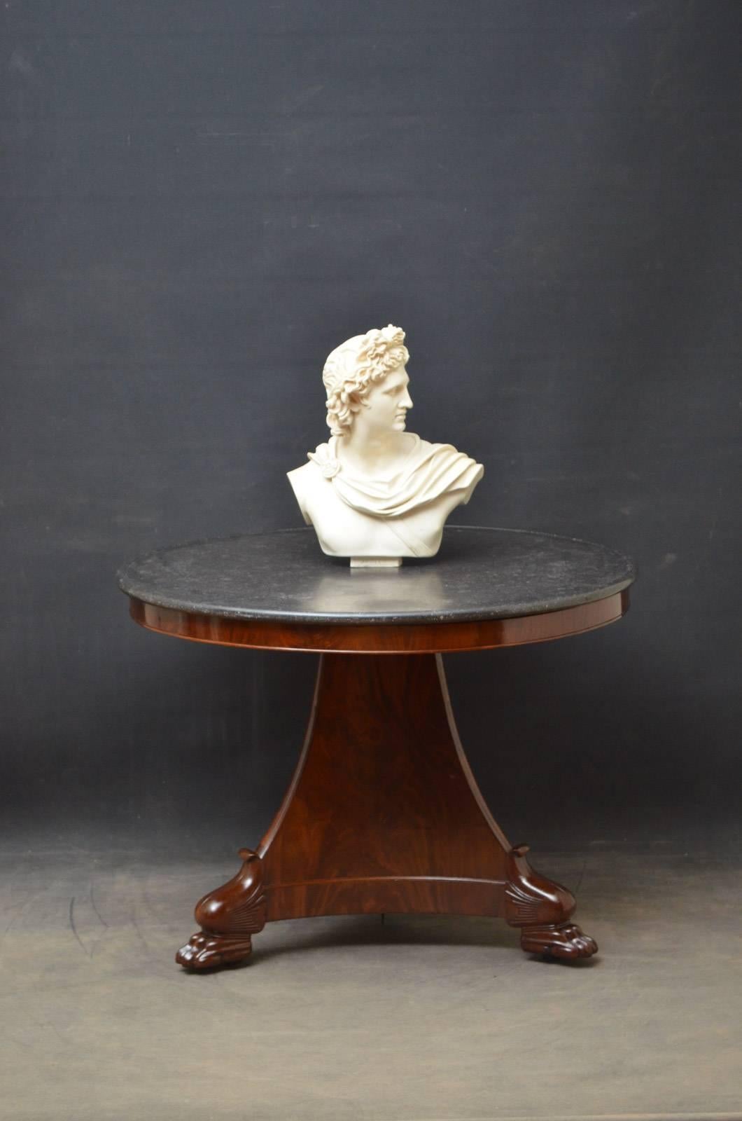 Sn4358 good size William IV centre table with black marble top and moulded frieze, standing on shaped, flamed mahogany three sided support terminating in paw feet and castors. This antique centre table has been sympathetically restored and is ready