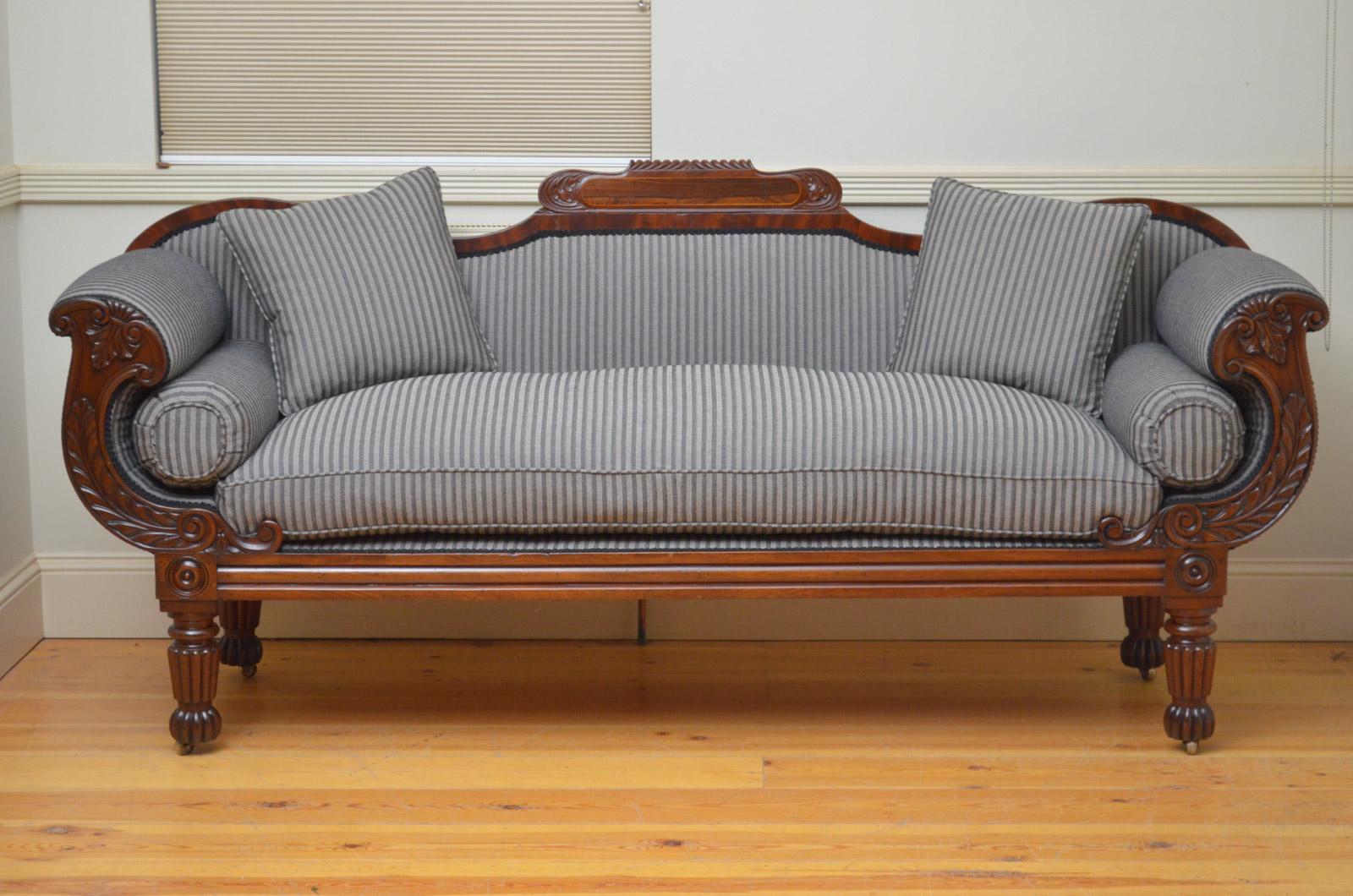 Sn4423, fine quality and very elegant William IV mahogany sofa of generous proportions, having shaped and carved top rail with rosewood panel to centre and fully upholstered back and seat with bolster and scatter cushions, all flanked by finely card
