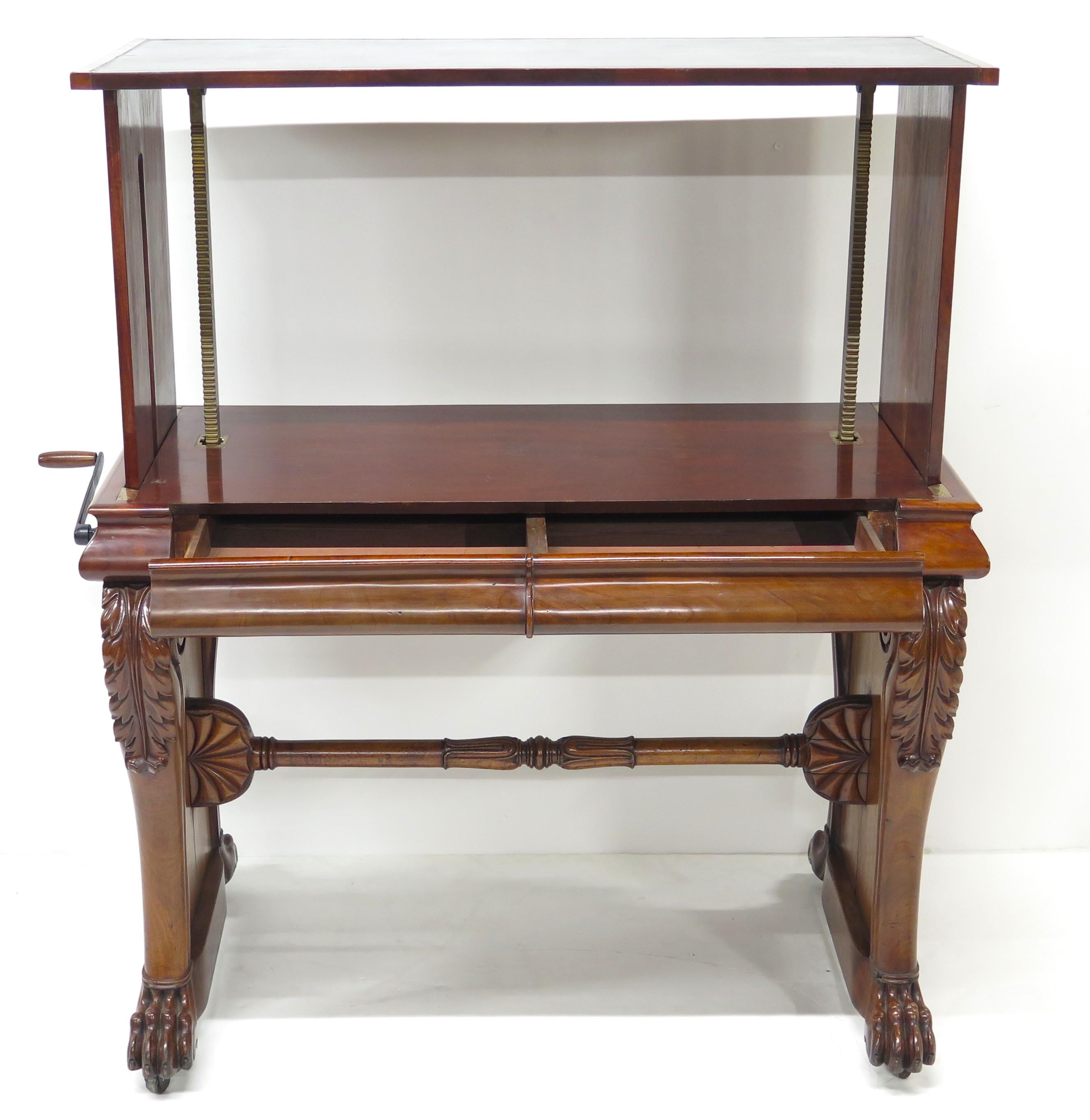 William IV mahogany stretcher based library table with black leather top / surface, top height is adjustable with  crank on side, lions paw feet, '' Hodges Dublin 