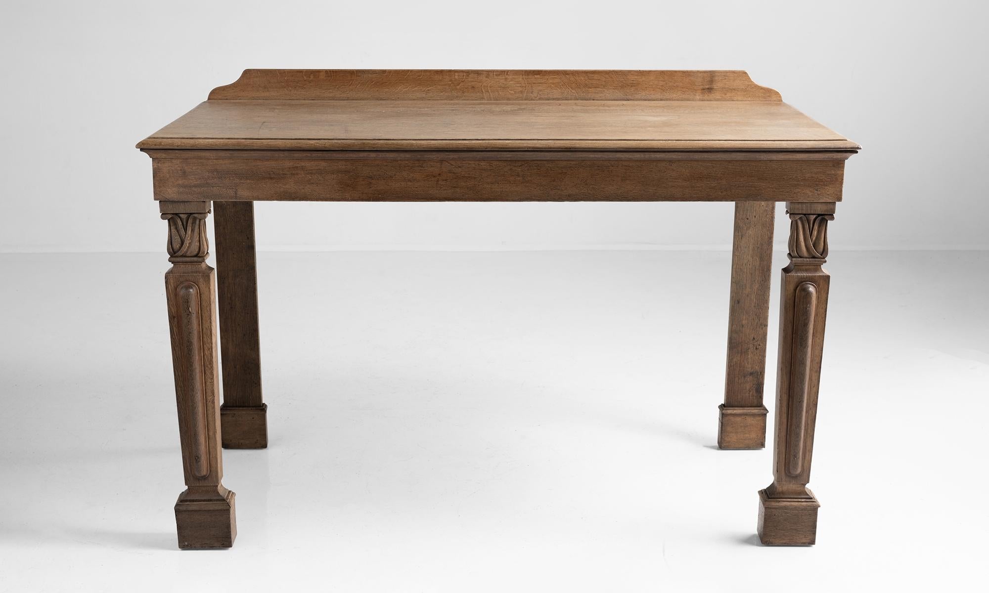 Large oak console with carved front legs and moulded edge.