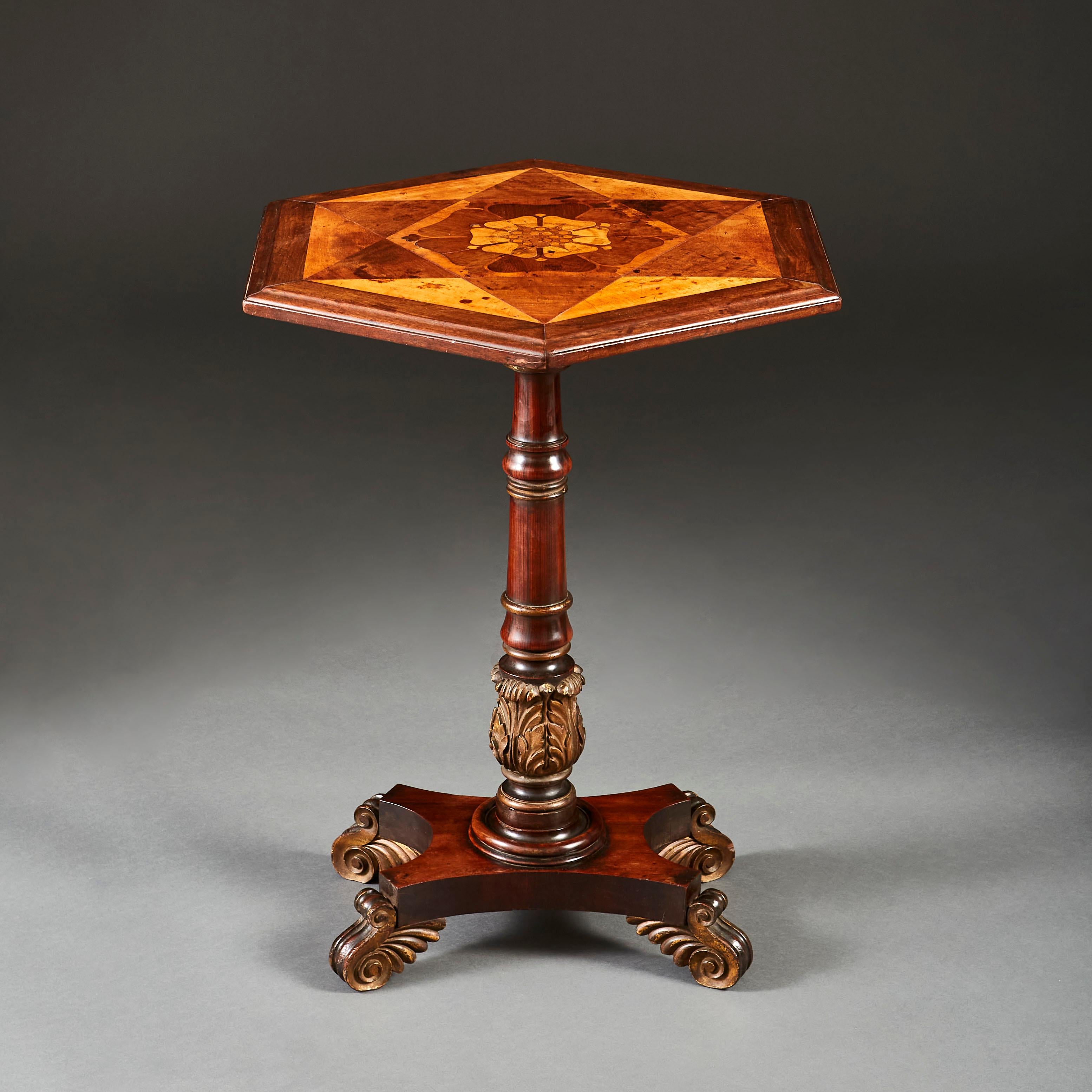 A William IV an early 19th century occasional table with hexagonal parquetry top, inlaid with an English Tudor rose central to the top.

  