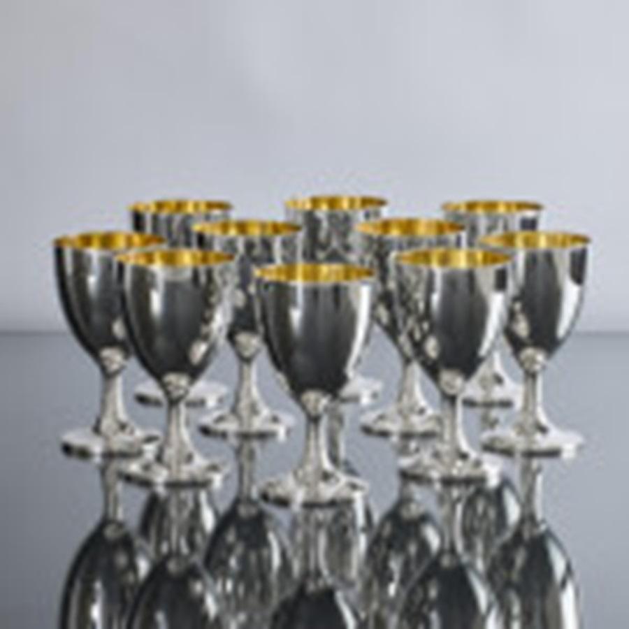 British Set of eight gilt-lined silver wine goblets